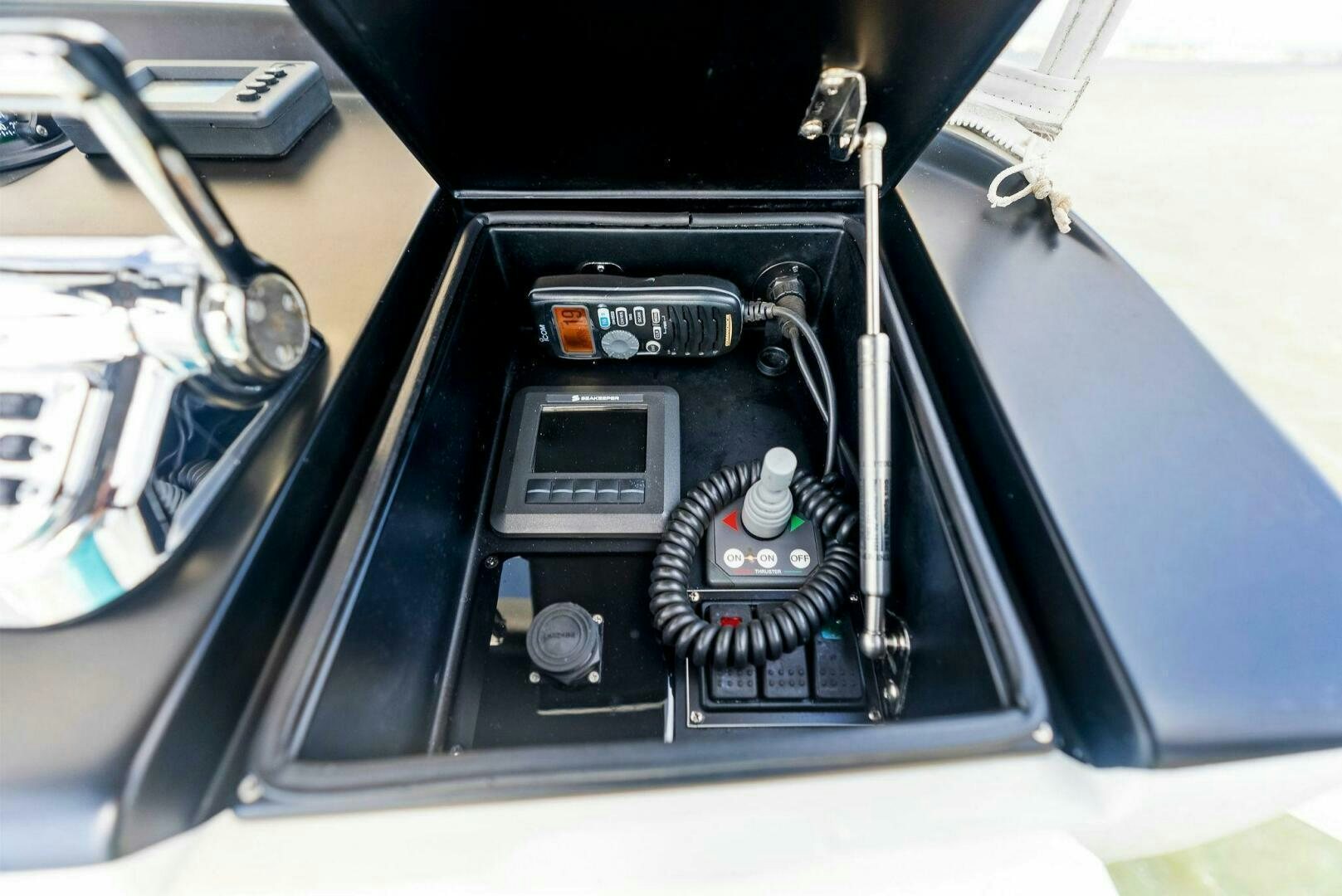 a black car with a black hood aboard PRINCESS LILY Yacht for Sale