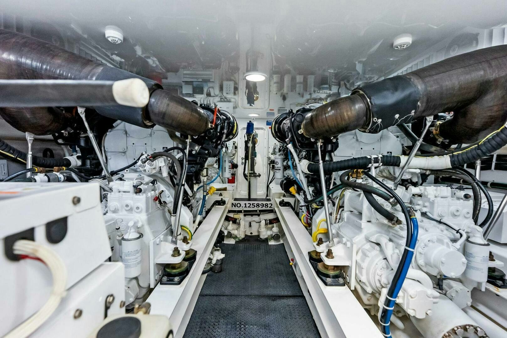 a car engine with many pipes aboard PRINCESS LILY Yacht for Sale