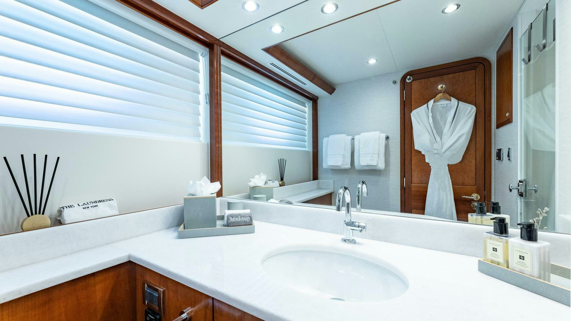 a bathroom with a large mirror aboard NO SHORTCUTS Yacht for Sale