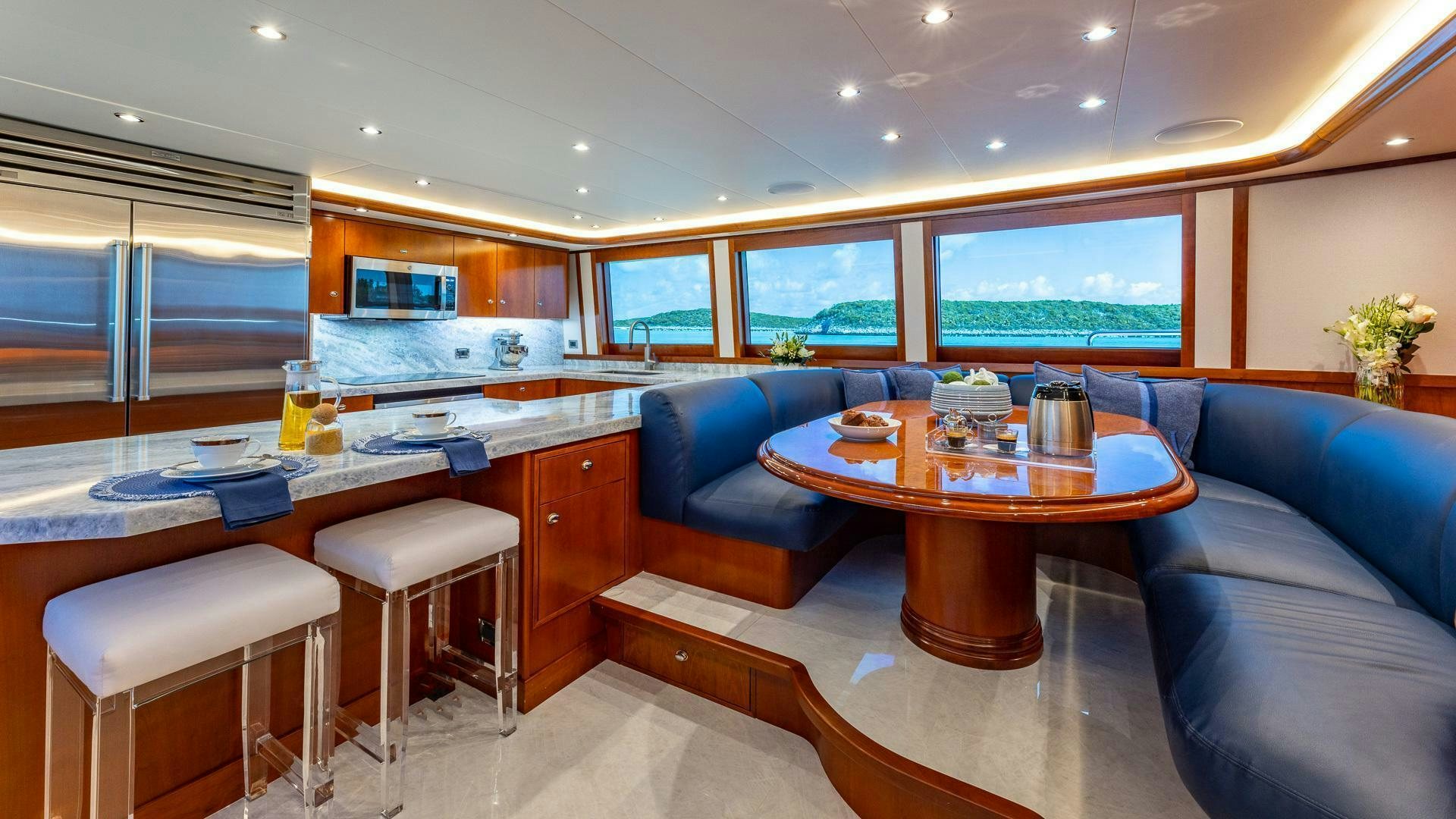 a living room with a table and chairs aboard NO SHORTCUTS Yacht for Sale