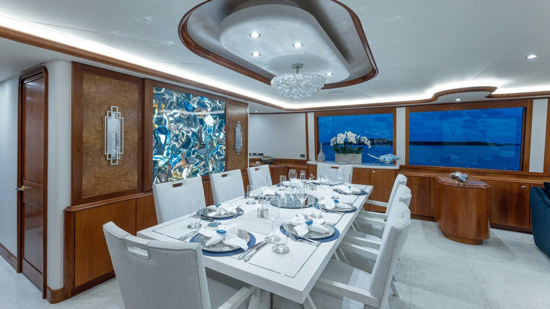 a dining room with a table and chairs aboard NO SHORTCUTS Yacht for Sale
