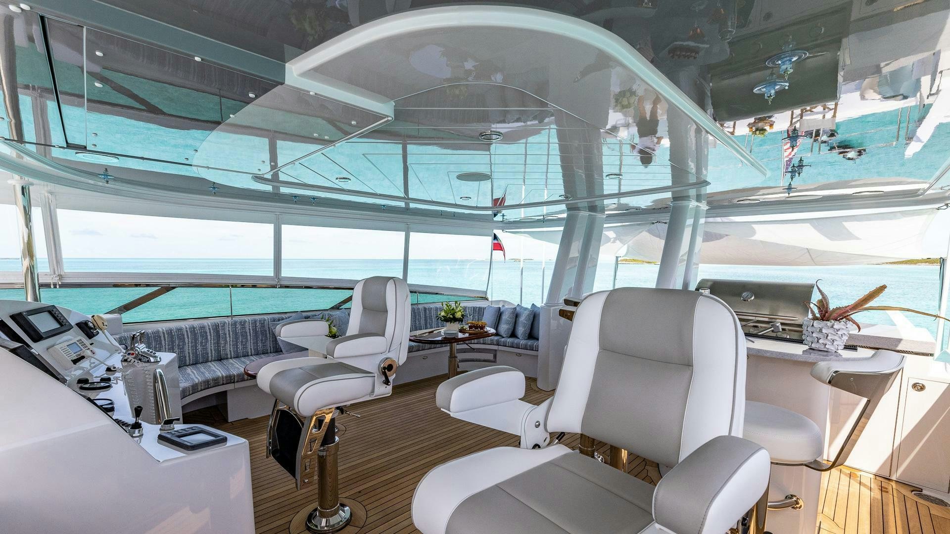 inside of a building with a large glass ceiling and a table with chairs aboard NO SHORTCUTS Yacht for Sale