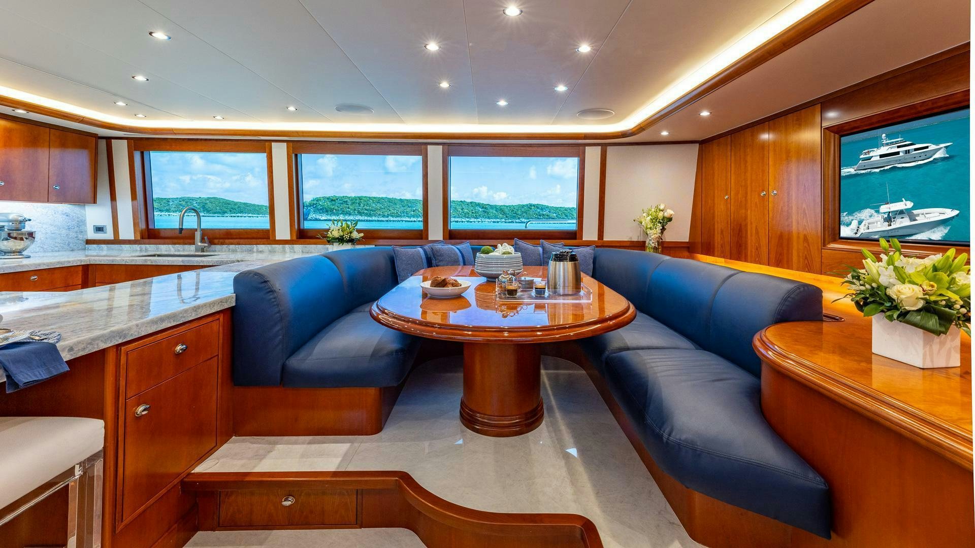 a living room with a couch and a coffee table aboard NO SHORTCUTS Yacht for Sale