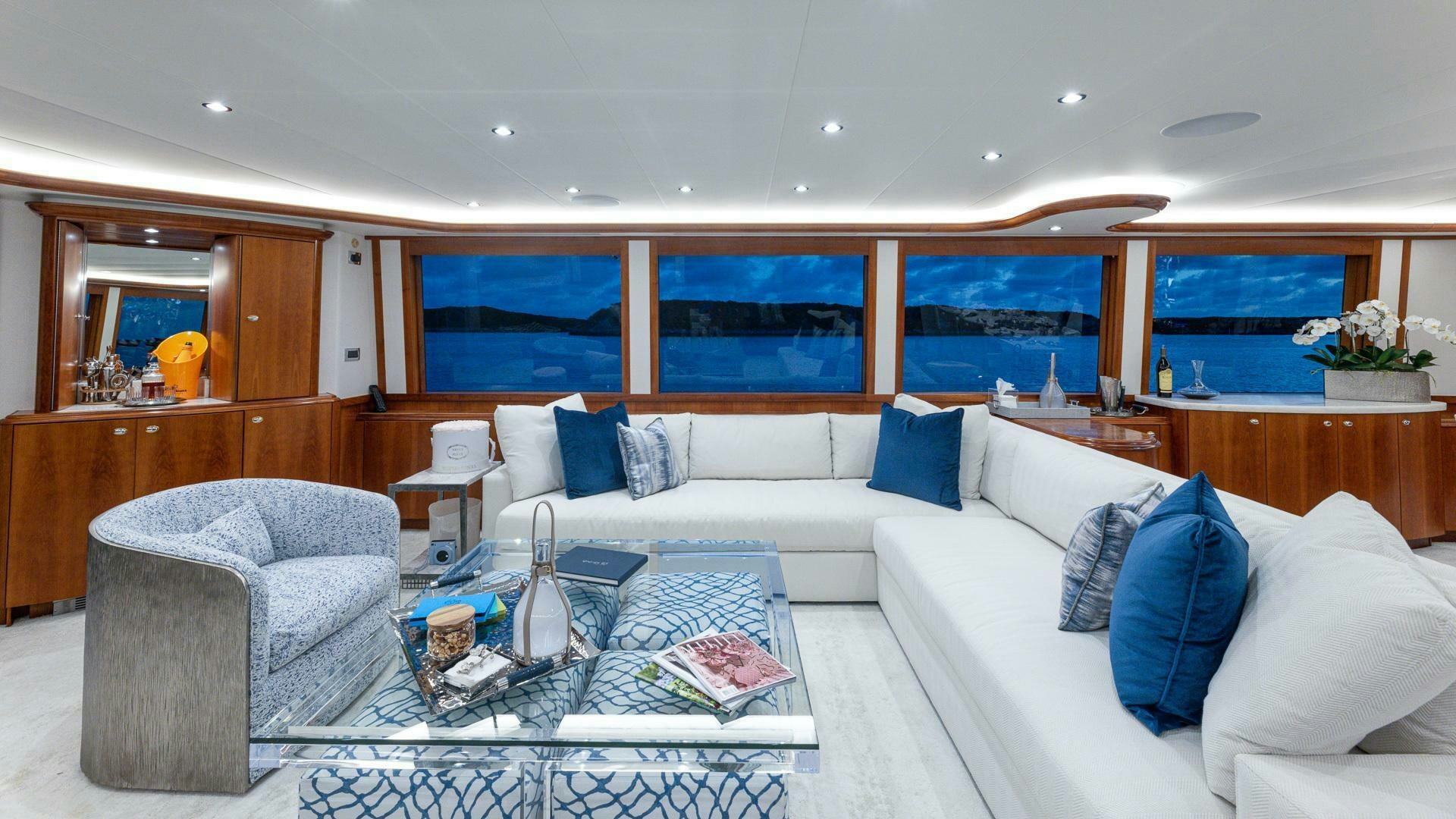a living room with a couch and a table aboard NO SHORTCUTS Yacht for Sale