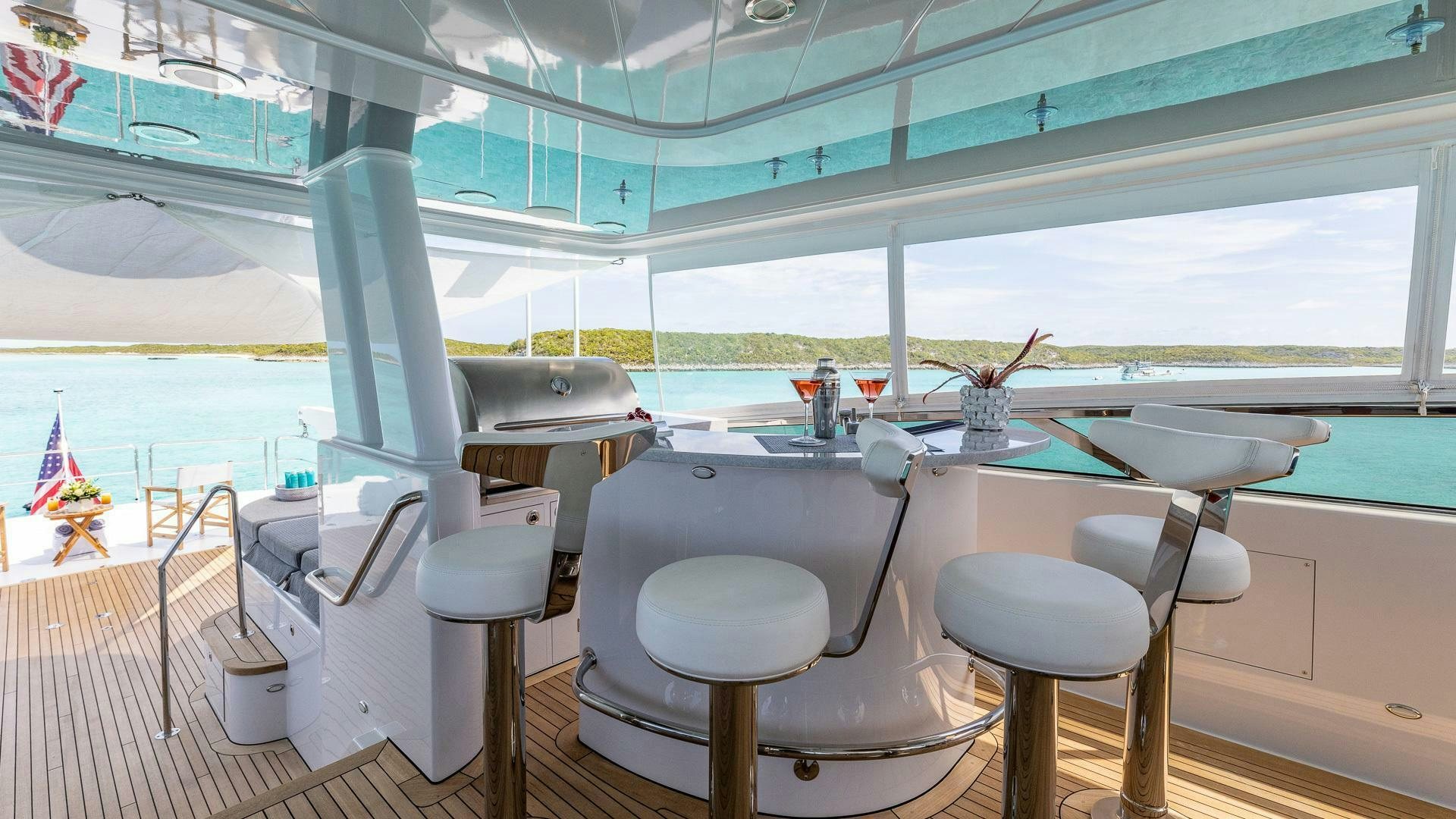 a boat with stools and chairs aboard NO SHORTCUTS Yacht for Sale
