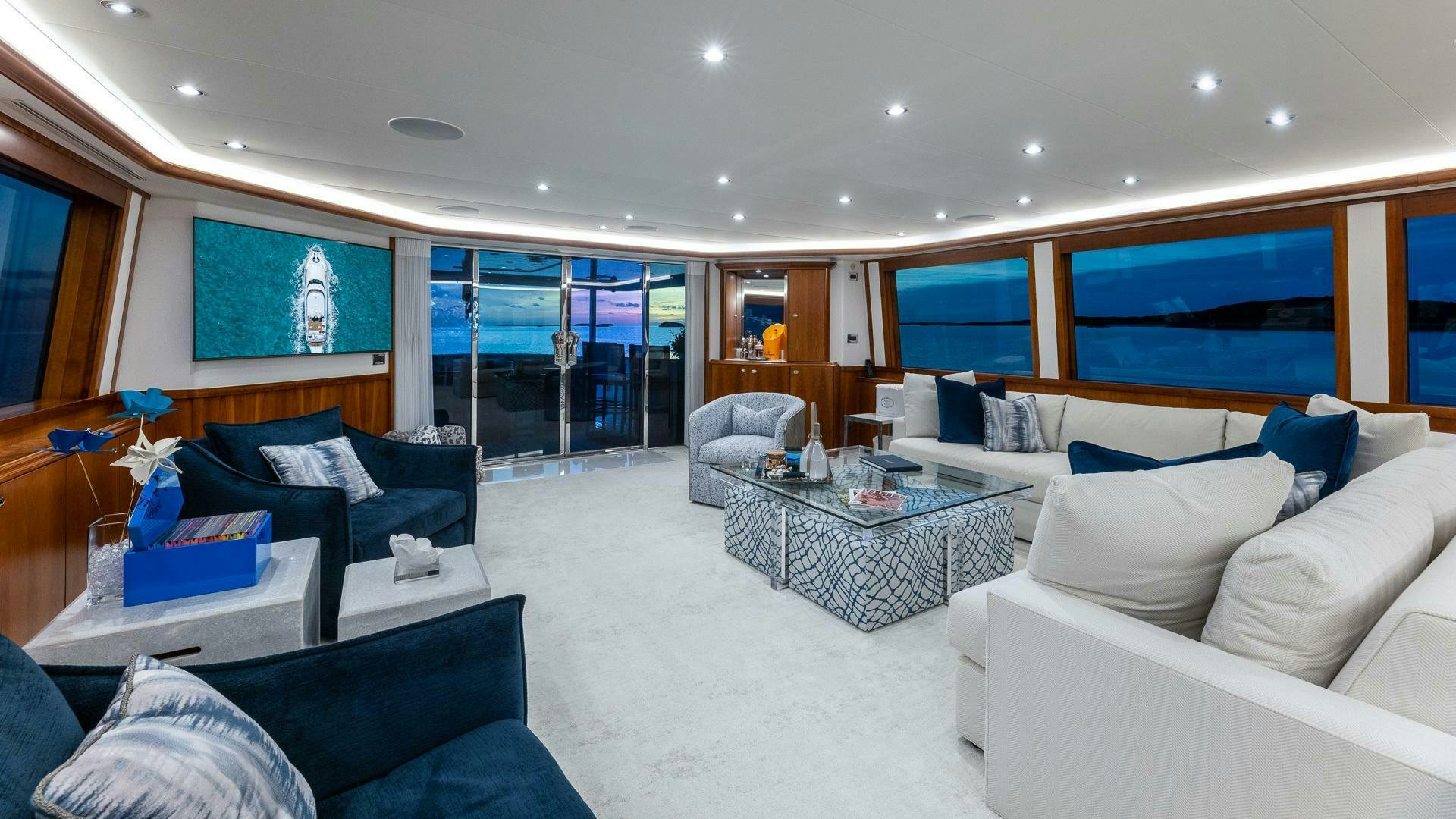 a living room with a couch and a table aboard NO SHORTCUTS Yacht for Sale