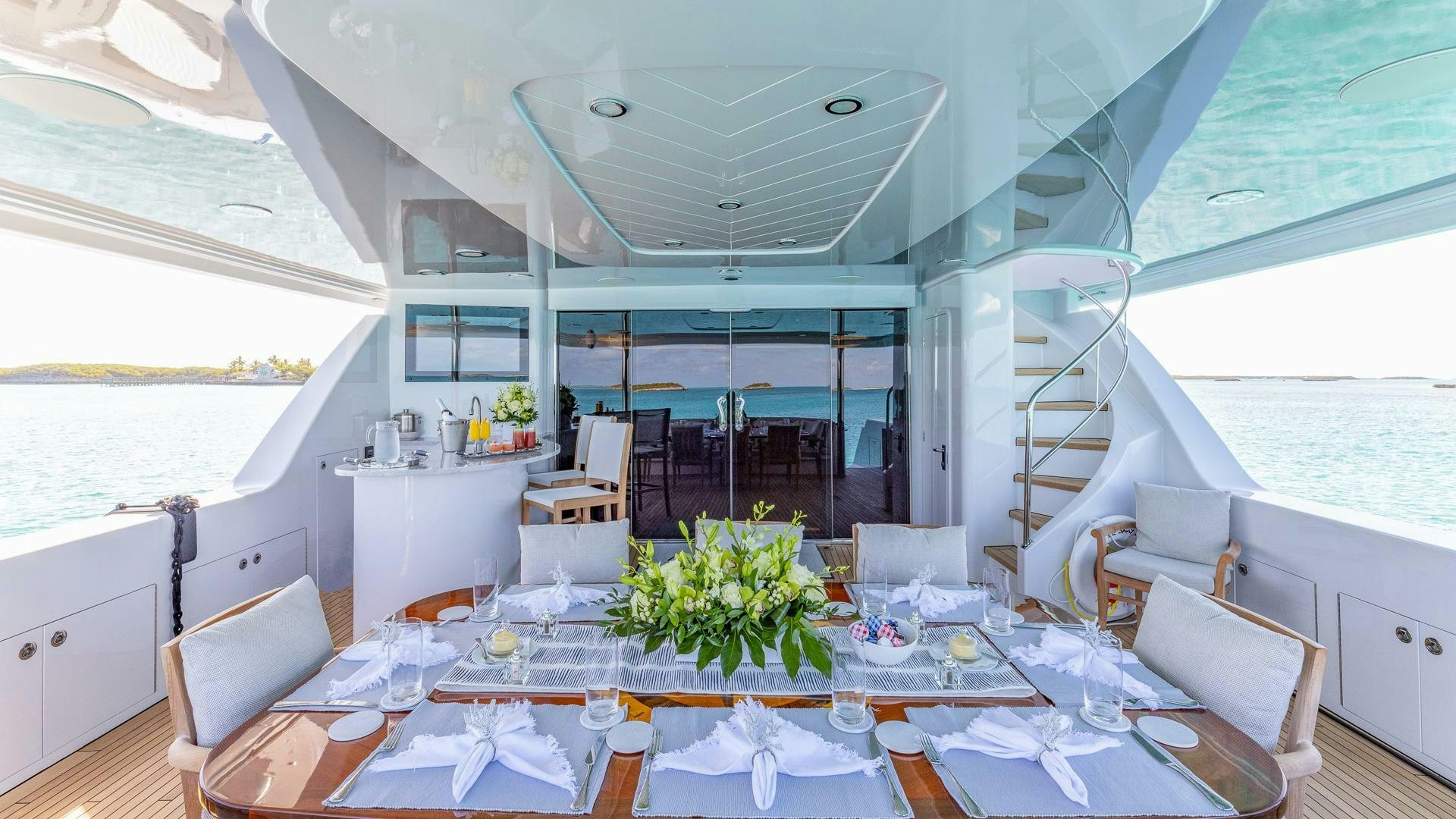 a dining room with a table and chairs aboard NO SHORTCUTS Yacht for Sale