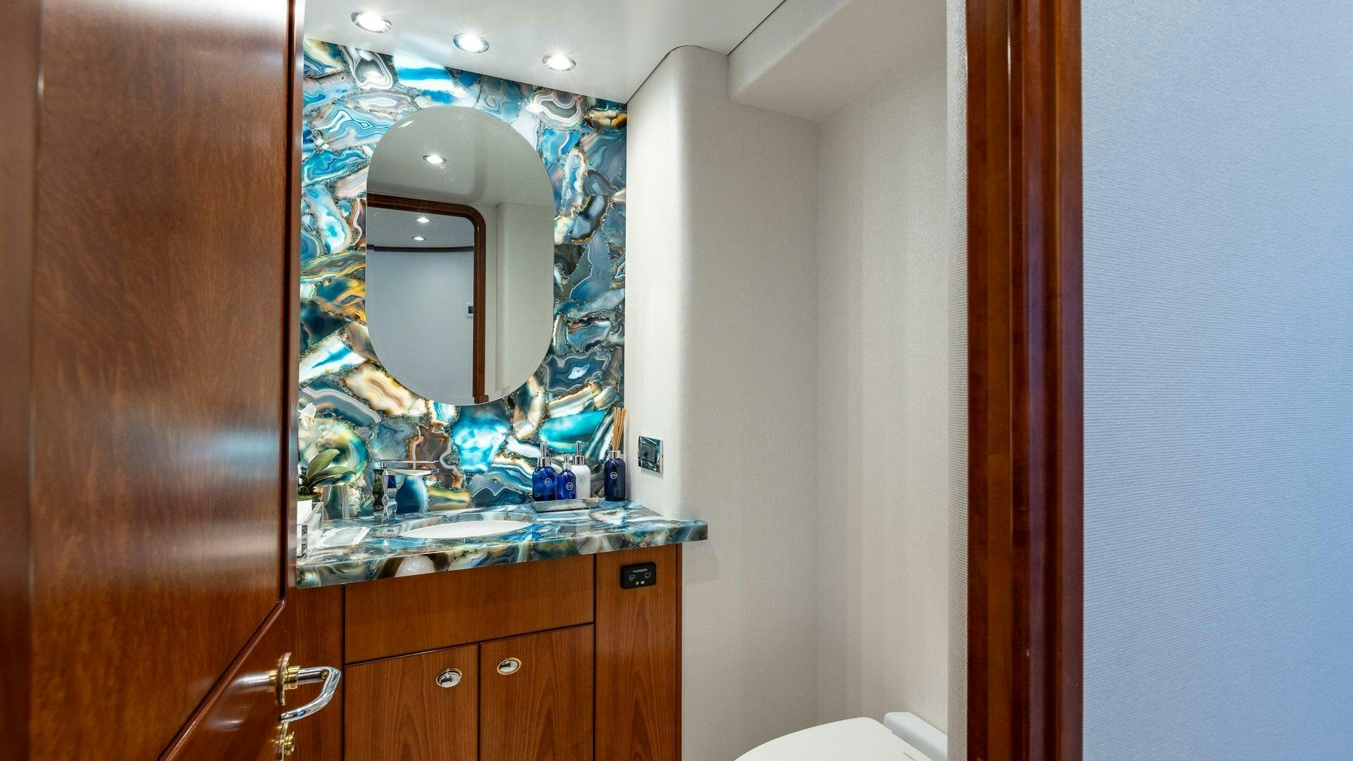 a bathroom with a large mirror aboard NO SHORTCUTS Yacht for Sale