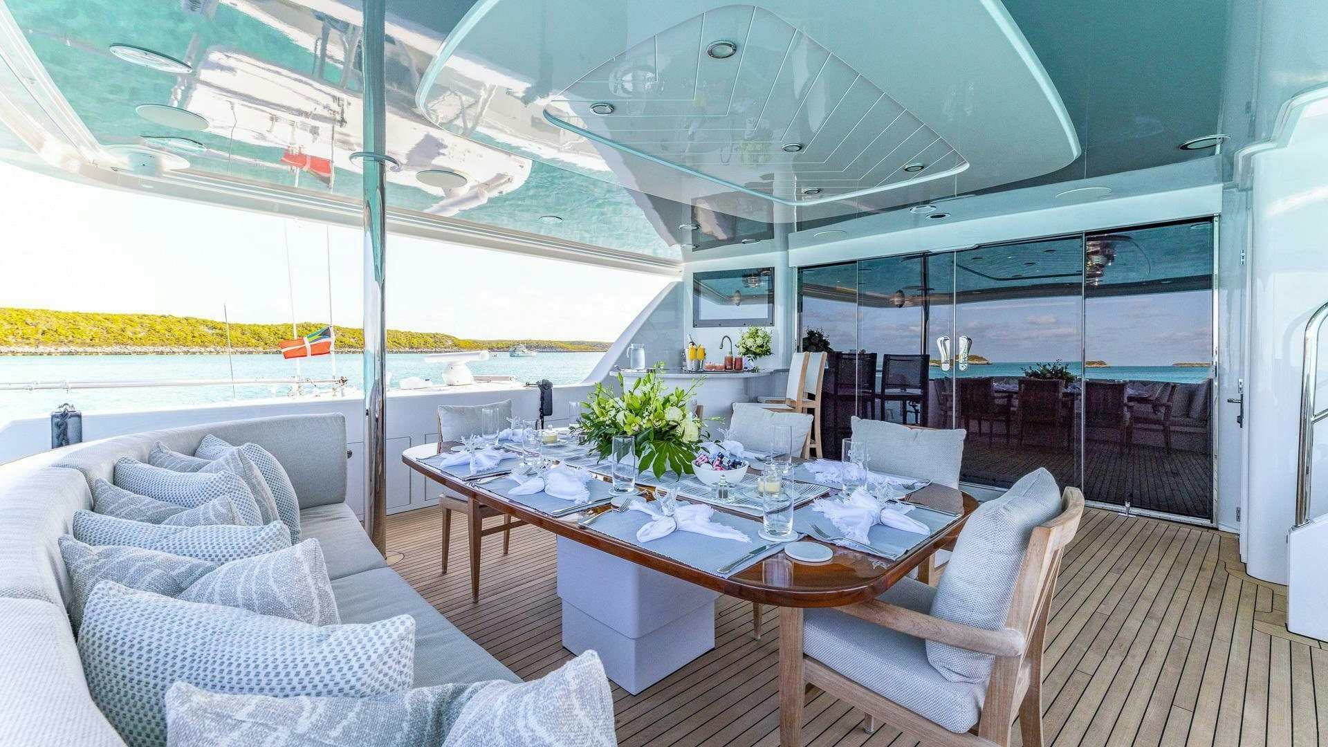 a large room with a table and chairs aboard NO SHORTCUTS Yacht for Sale