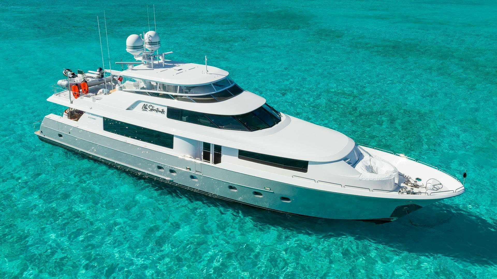 a white boat in the water aboard NO SHORTCUTS Yacht for Sale