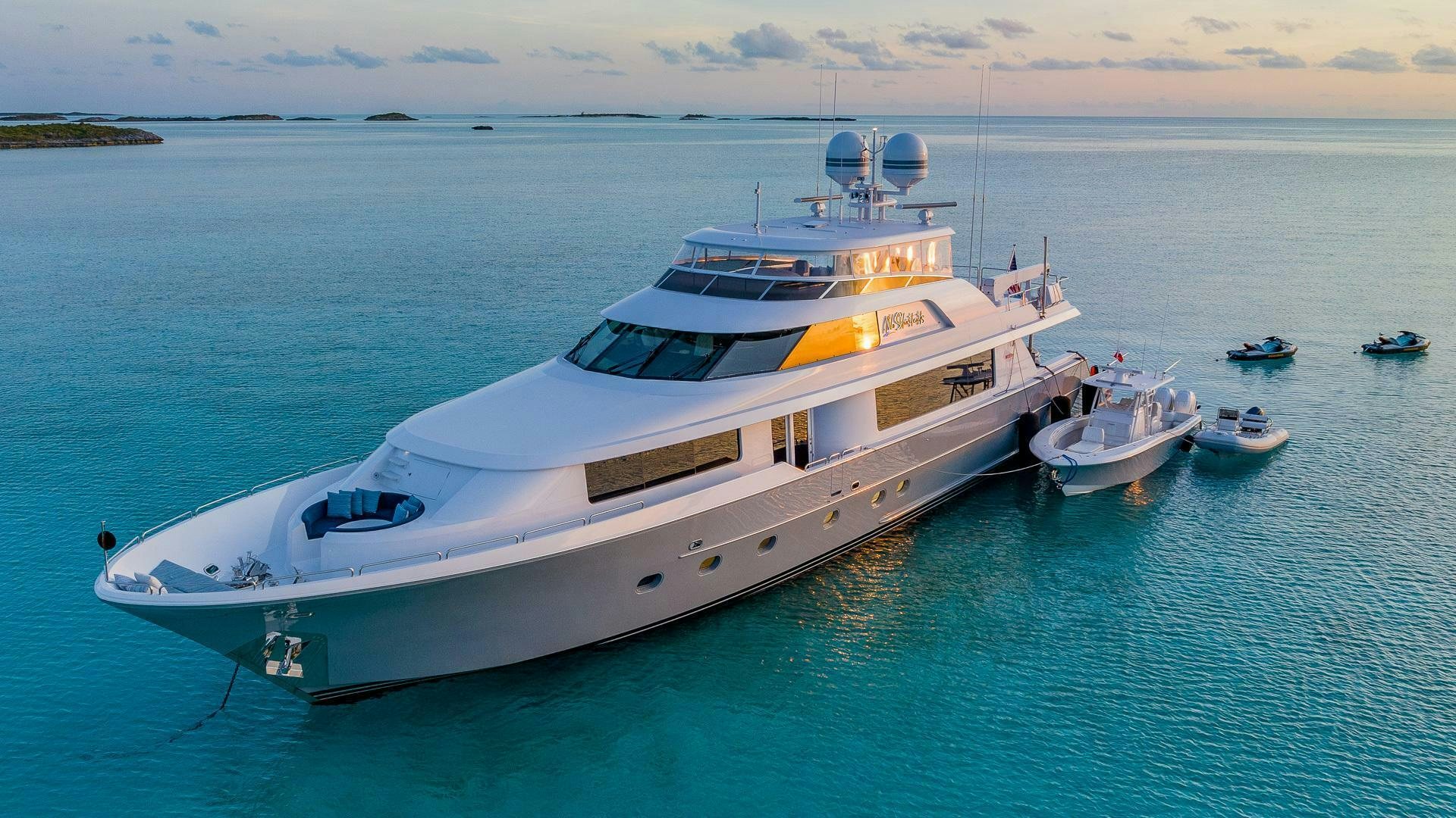 a large white boat in the water aboard NO SHORTCUTS Yacht for Sale