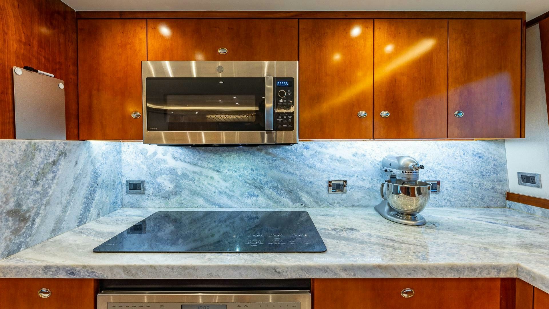 a kitchen with a black stove aboard NO SHORTCUTS Yacht for Sale
