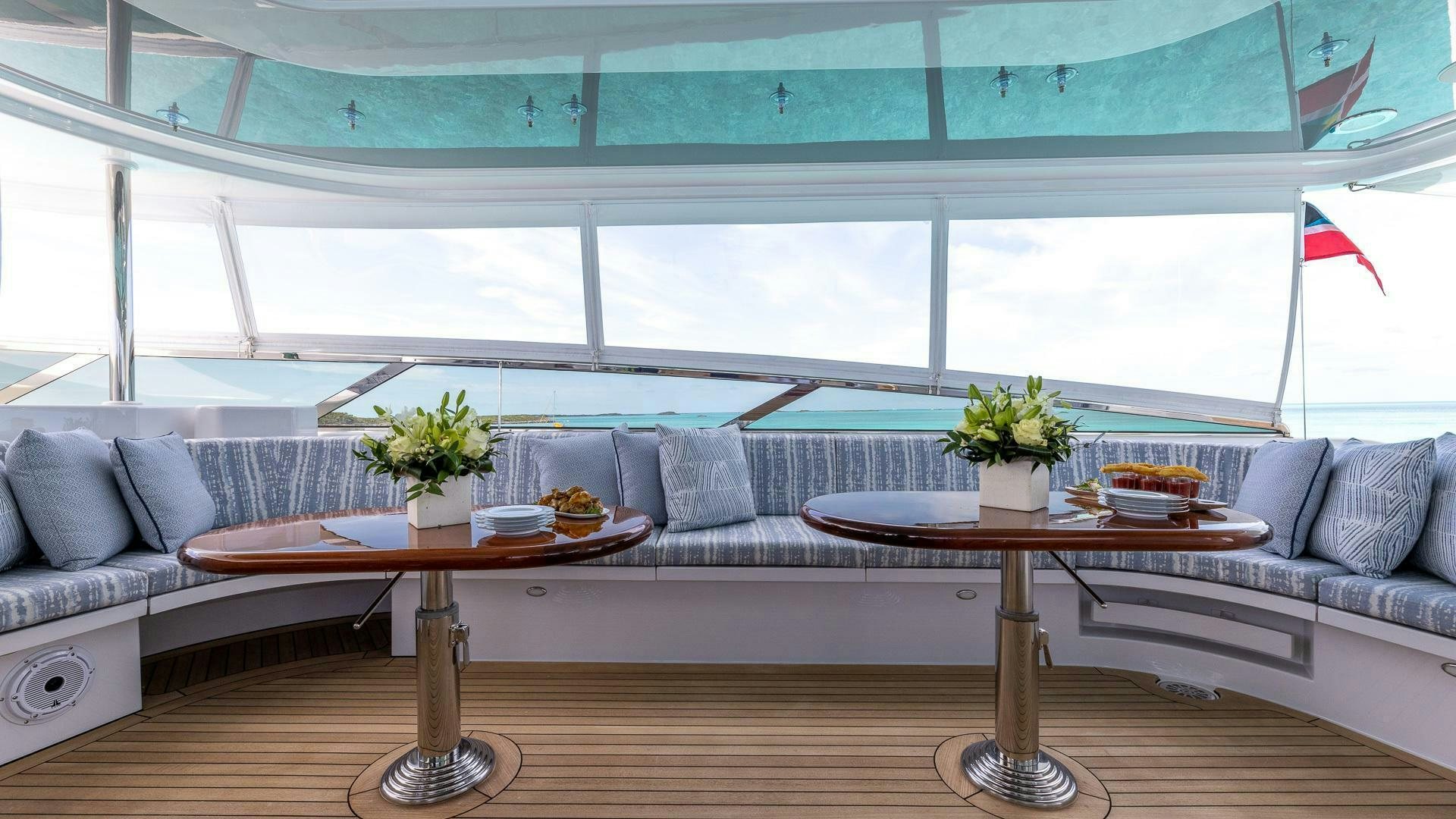a living room with a couch and table aboard NO SHORTCUTS Yacht for Sale