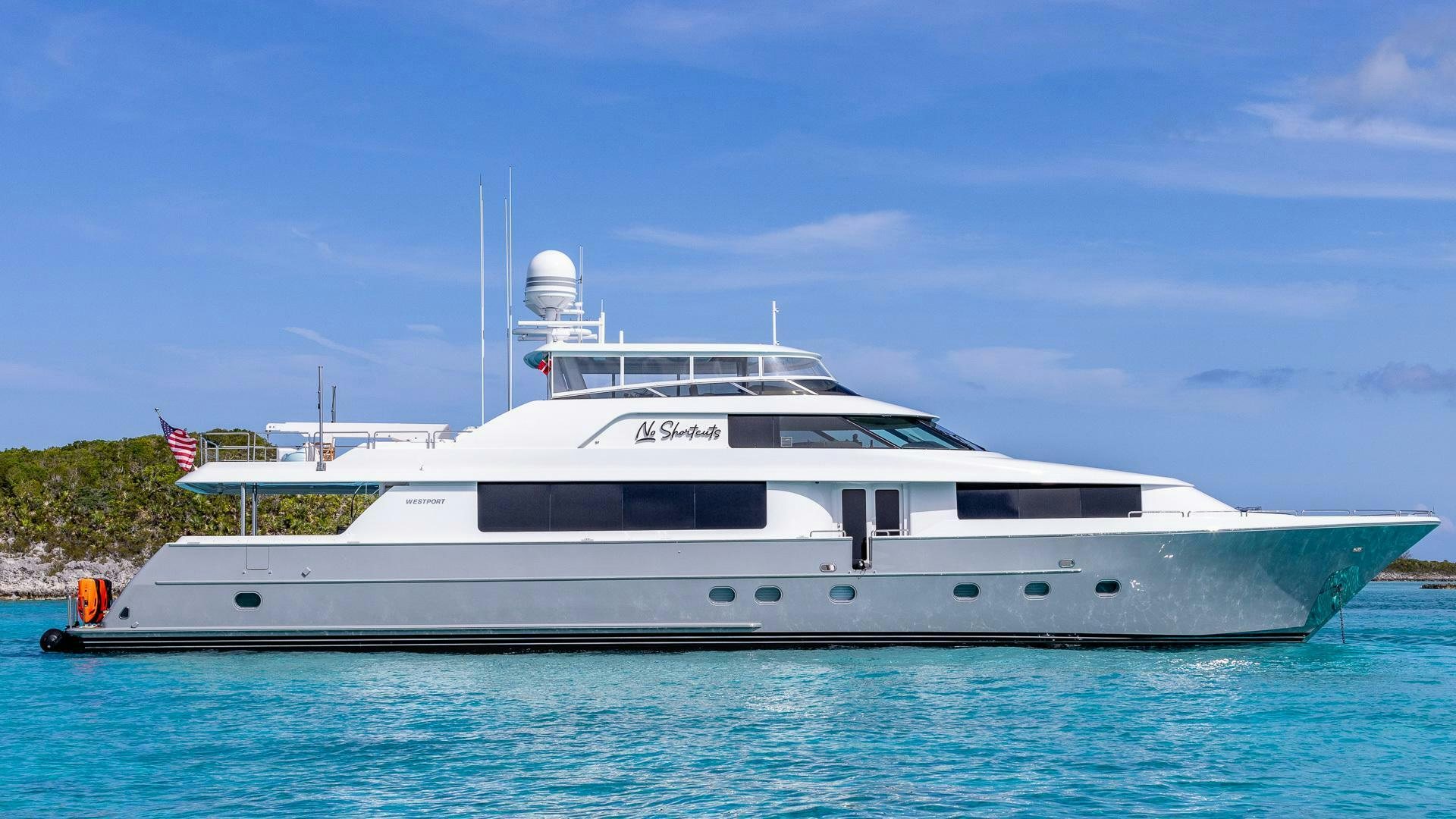 a large white boat in the water aboard NO SHORTCUTS Yacht for Sale