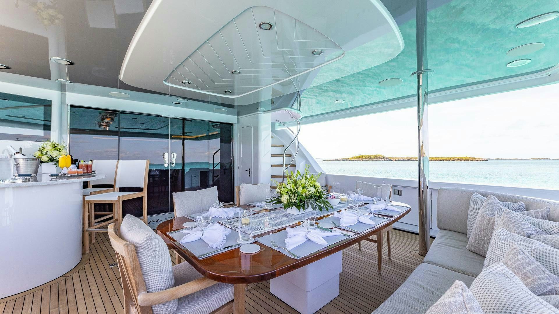 a room with a table chairs and a window aboard NO SHORTCUTS Yacht for Sale