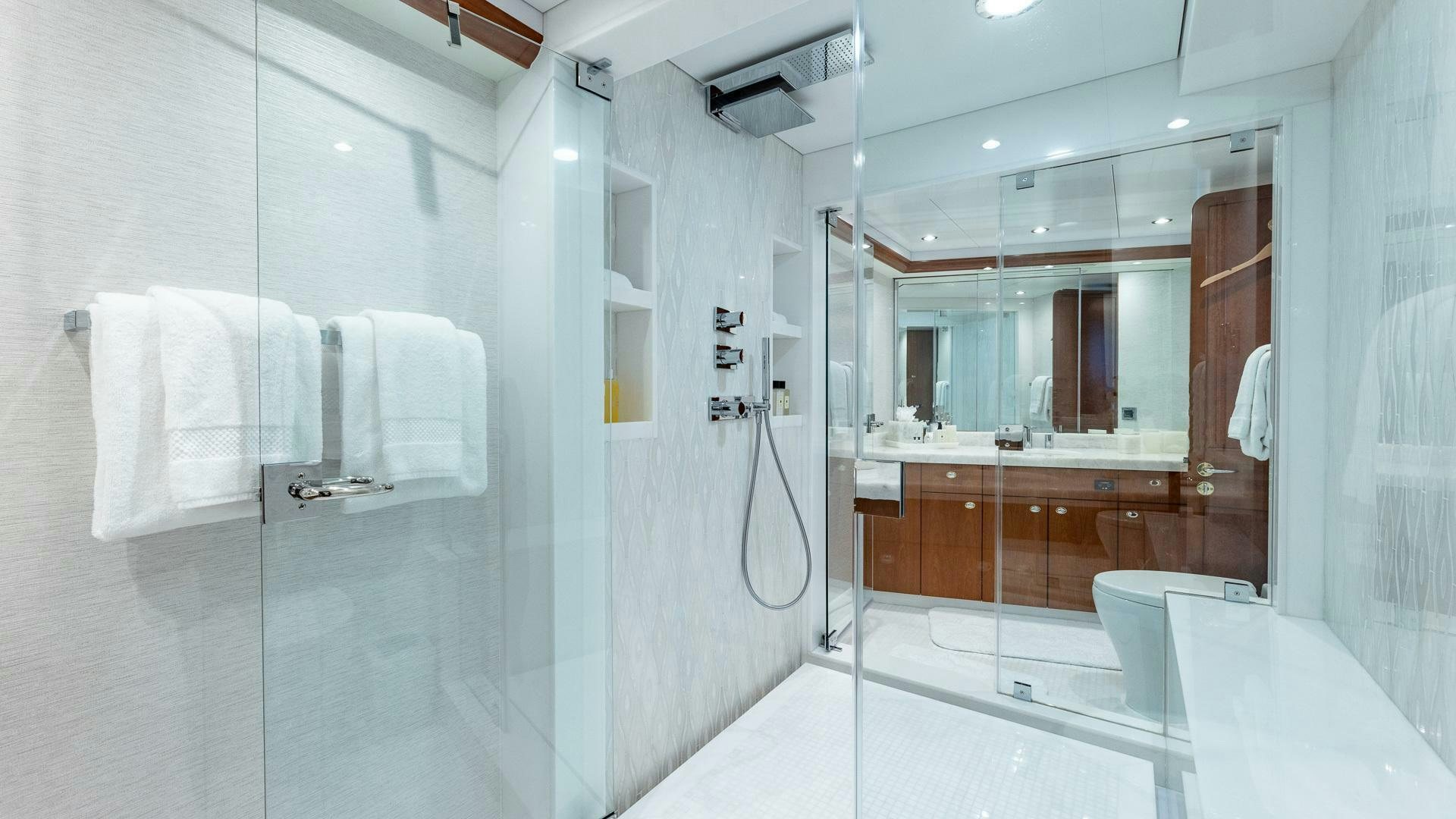 a bathroom with a large mirror aboard NO SHORTCUTS Yacht for Sale