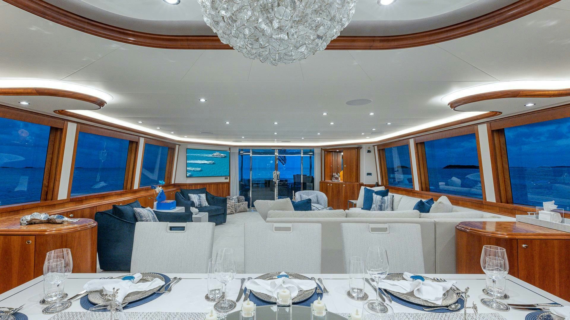 a large room with a table and chairs aboard NO SHORTCUTS Yacht for Sale