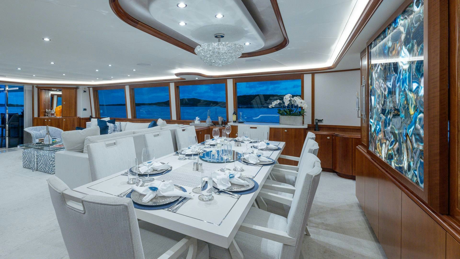 a large dining room with a large table and chairs aboard NO SHORTCUTS Yacht for Sale