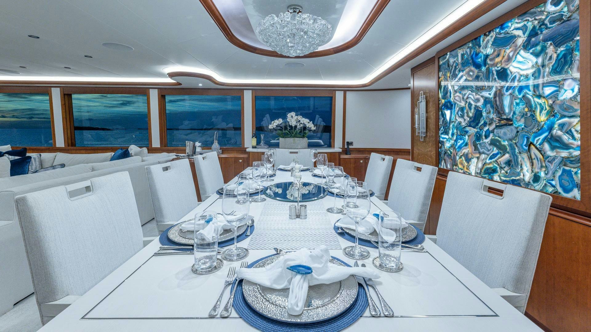 a large white table with plates and glasses on it aboard NO SHORTCUTS Yacht for Sale