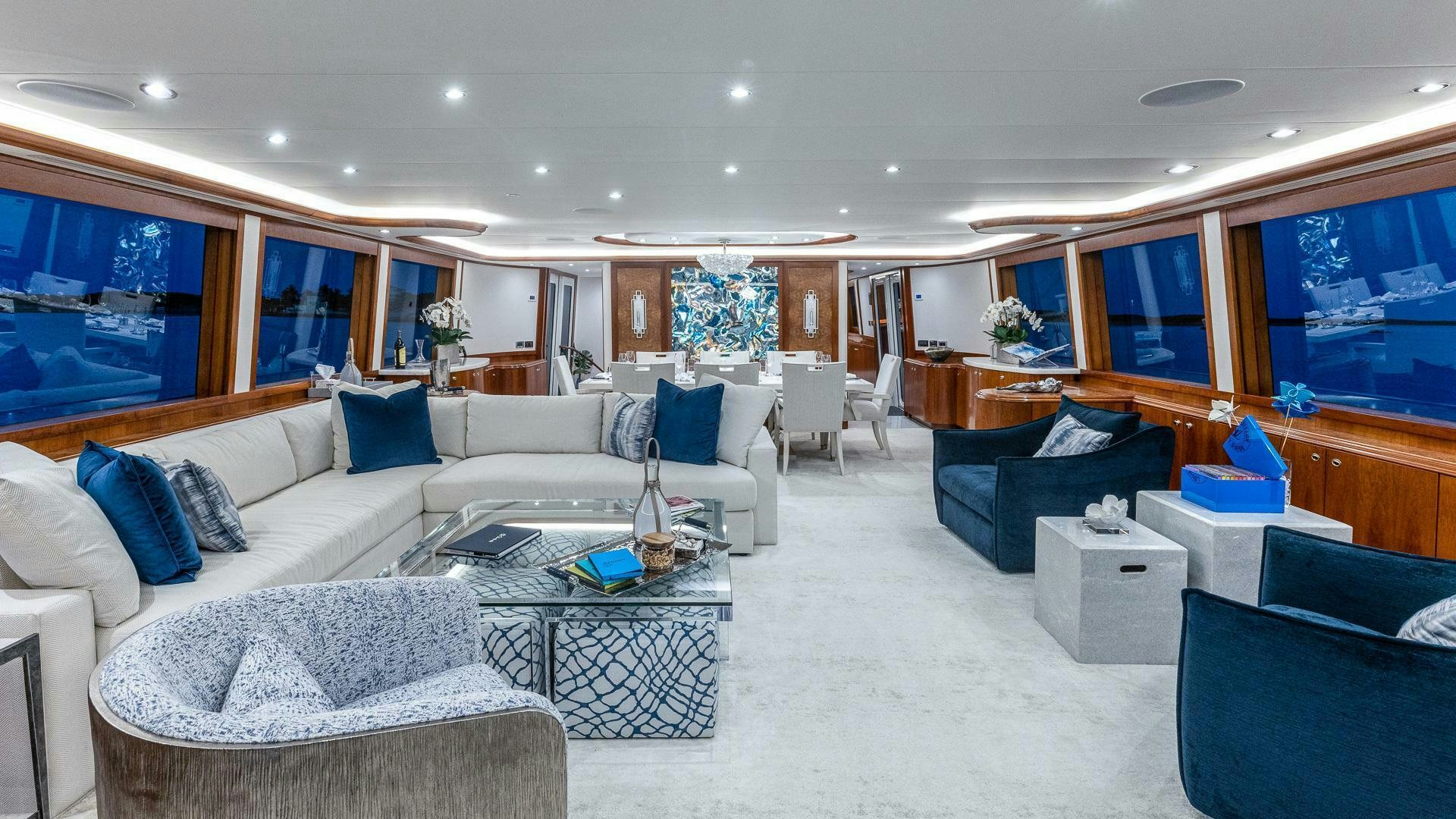 a living room with a large window aboard NO SHORTCUTS Yacht for Sale