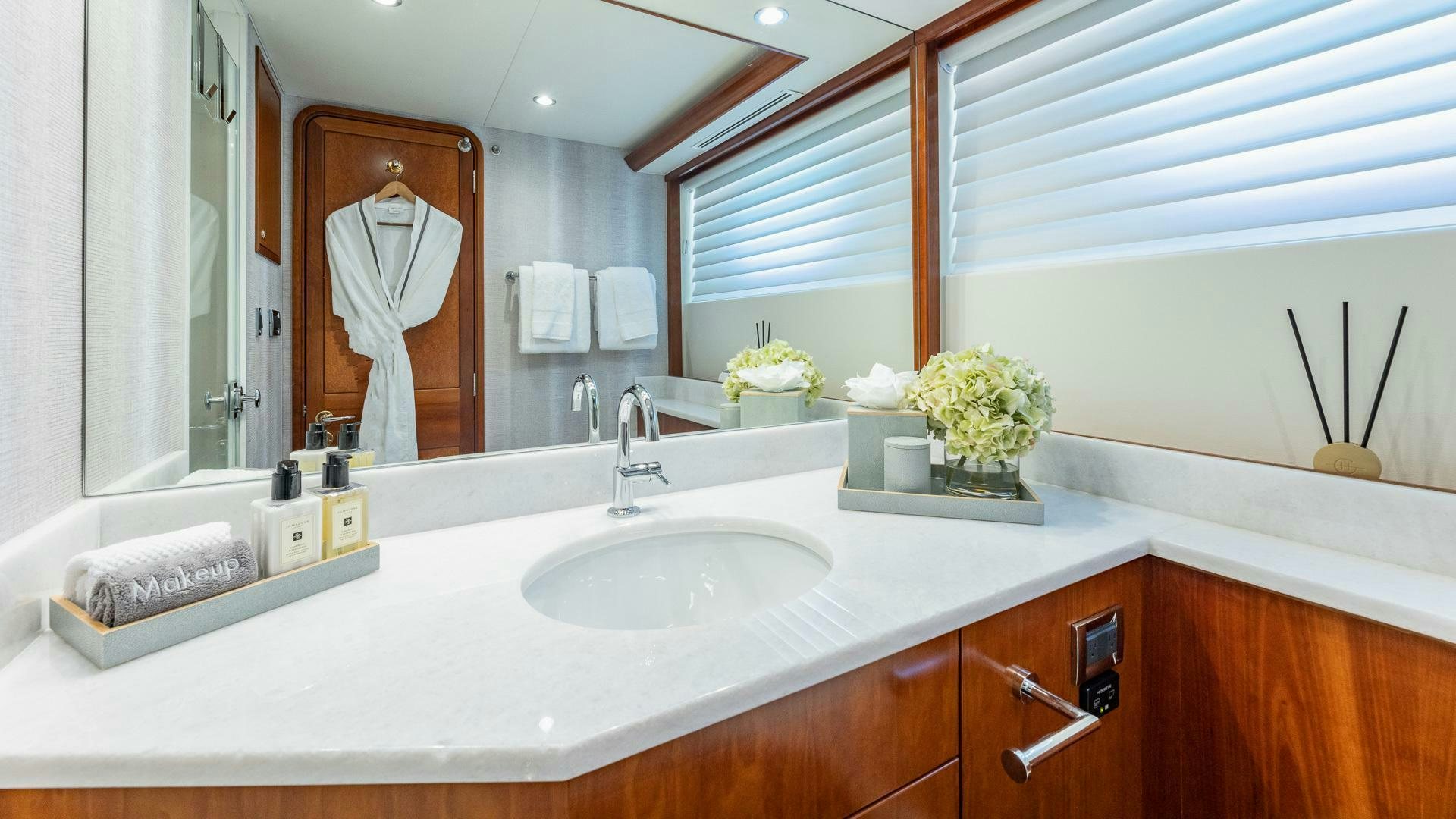 a person taking a picture of a bathroom aboard NO SHORTCUTS Yacht for Sale