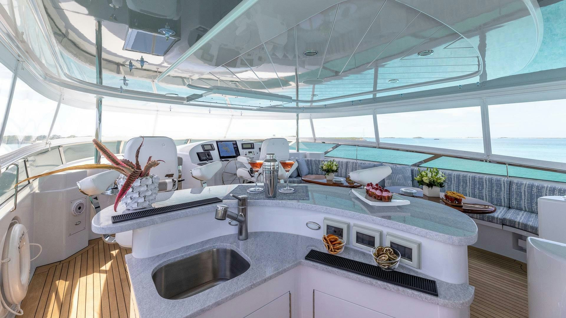 a kitchen with a large window aboard NO SHORTCUTS Yacht for Sale