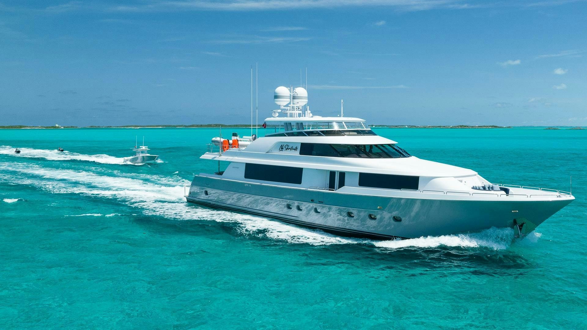 a white boat on the water aboard NO SHORTCUTS Yacht for Sale