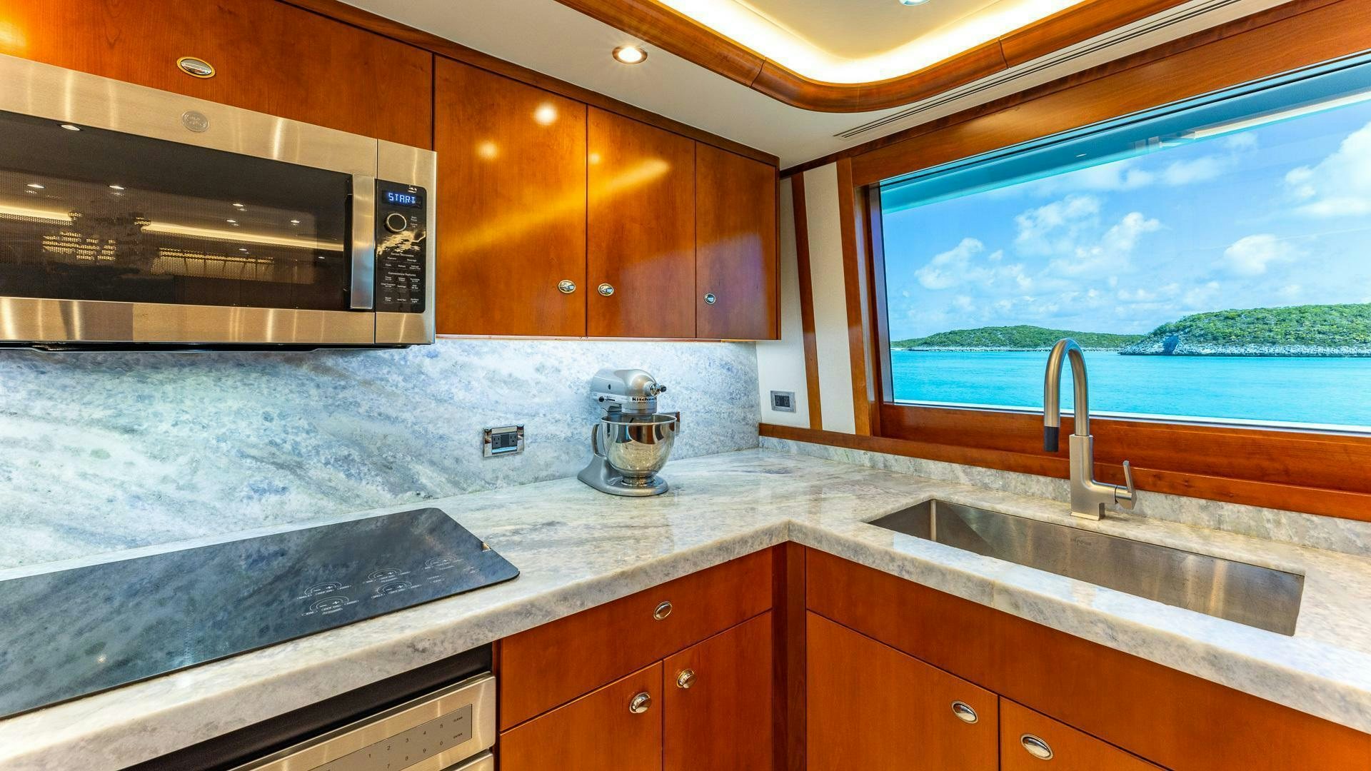 a kitchen with a large window aboard NO SHORTCUTS Yacht for Sale