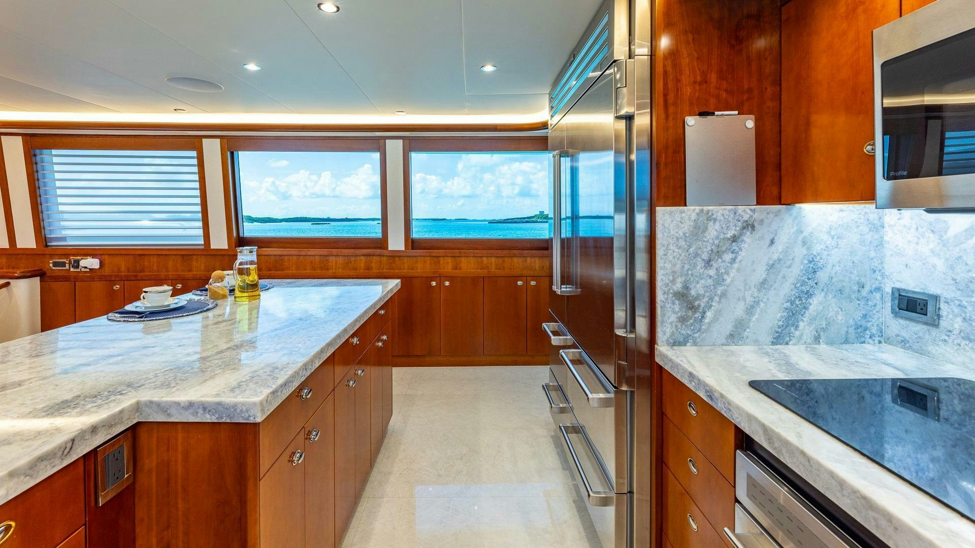a kitchen with a large island aboard NO SHORTCUTS Yacht for Sale