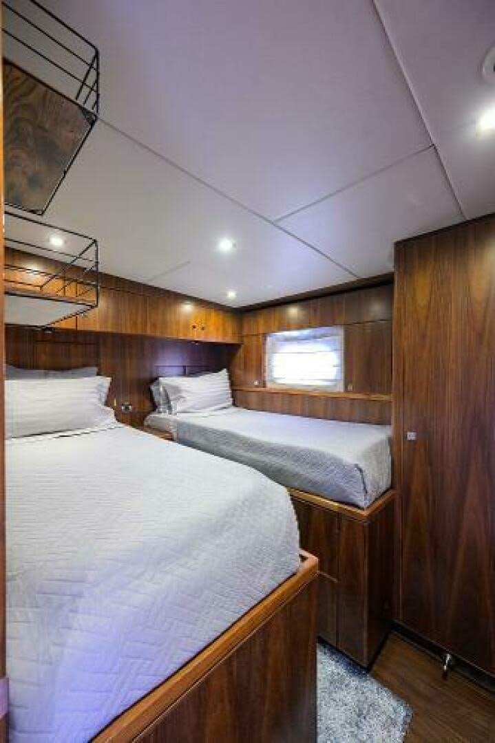 a couple of beds in a room aboard SECOND AMENDMENT Yacht for Sale