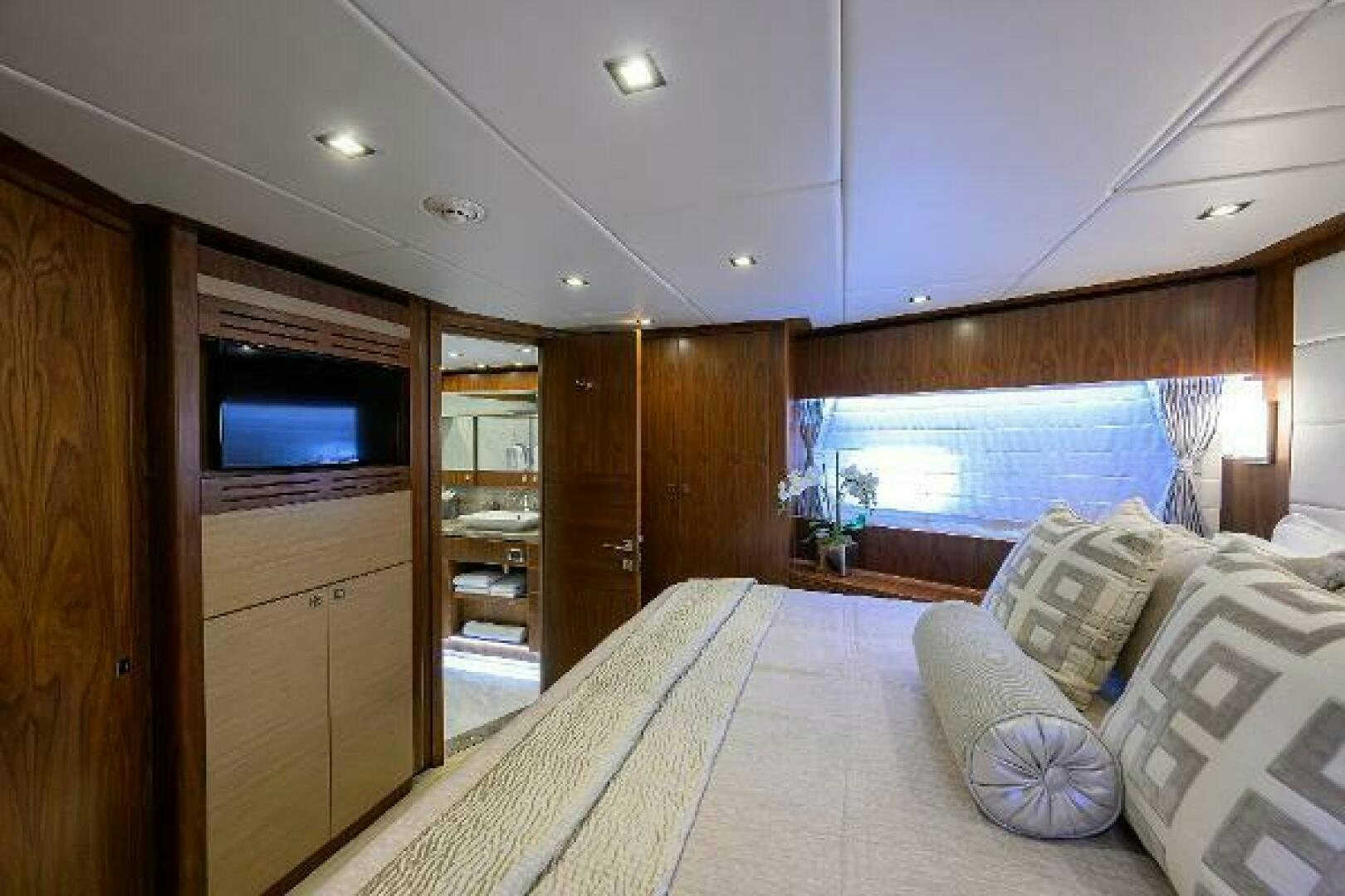 a bedroom with a large bed aboard SECOND AMENDMENT Yacht for Sale