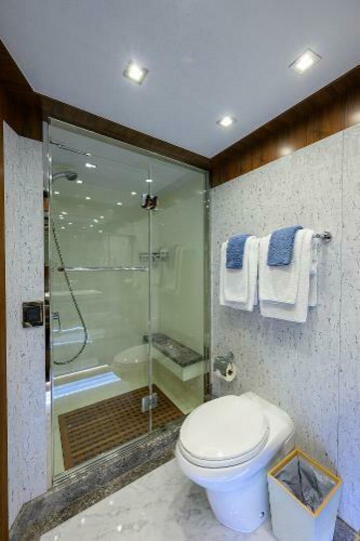 a bathroom with a glass shower aboard SECOND AMENDMENT Yacht for Sale