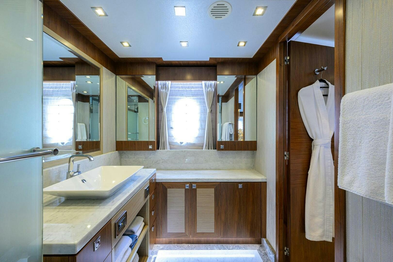a bathroom with a sink and a mirror aboard SECOND AMENDMENT Yacht for Sale