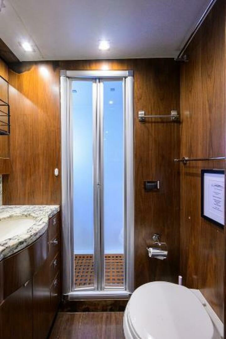 a bathroom with a shower and toilet aboard SECOND AMENDMENT Yacht for Sale