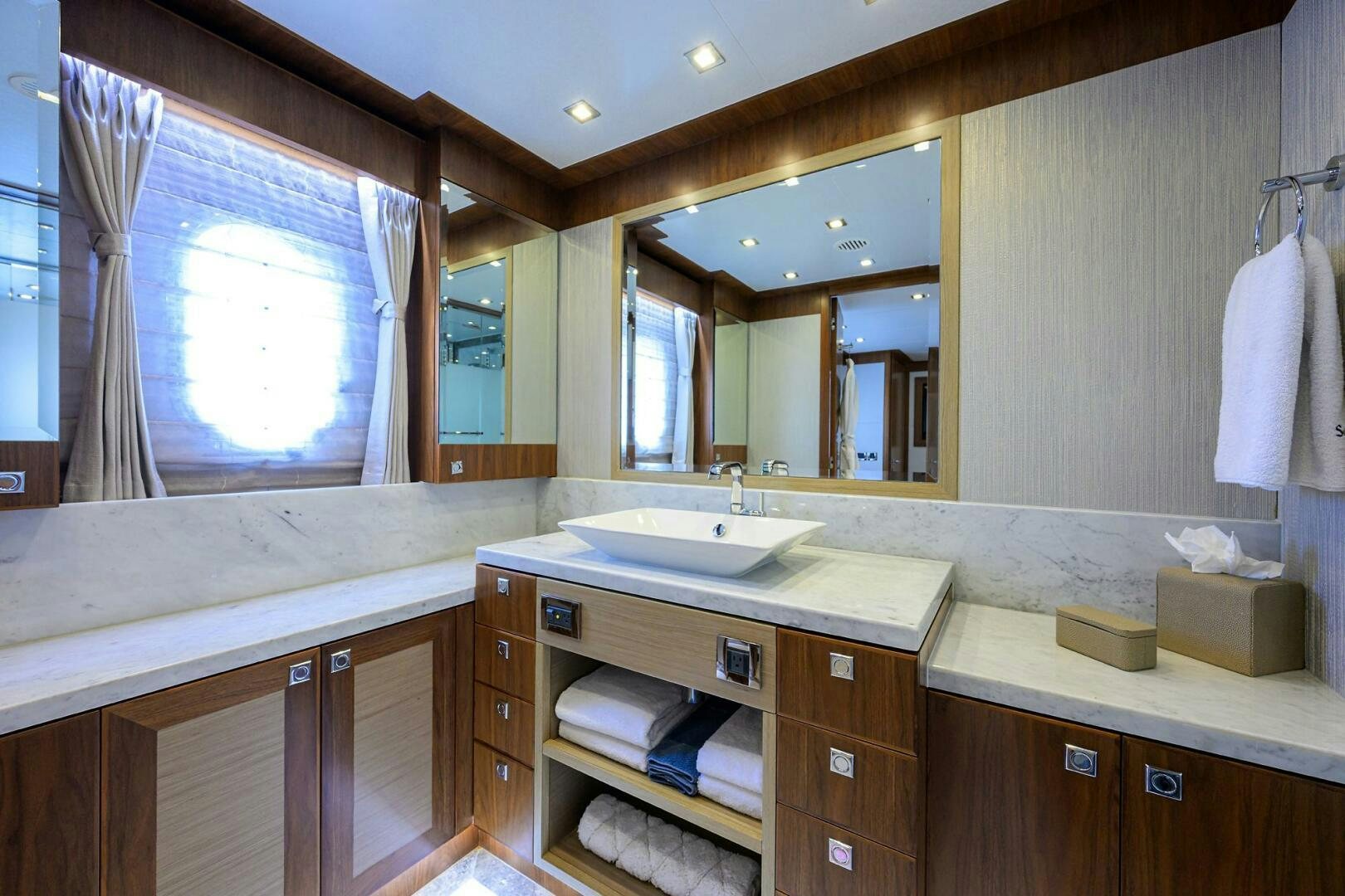 a bathroom with a large mirror aboard SECOND AMENDMENT Yacht for Sale