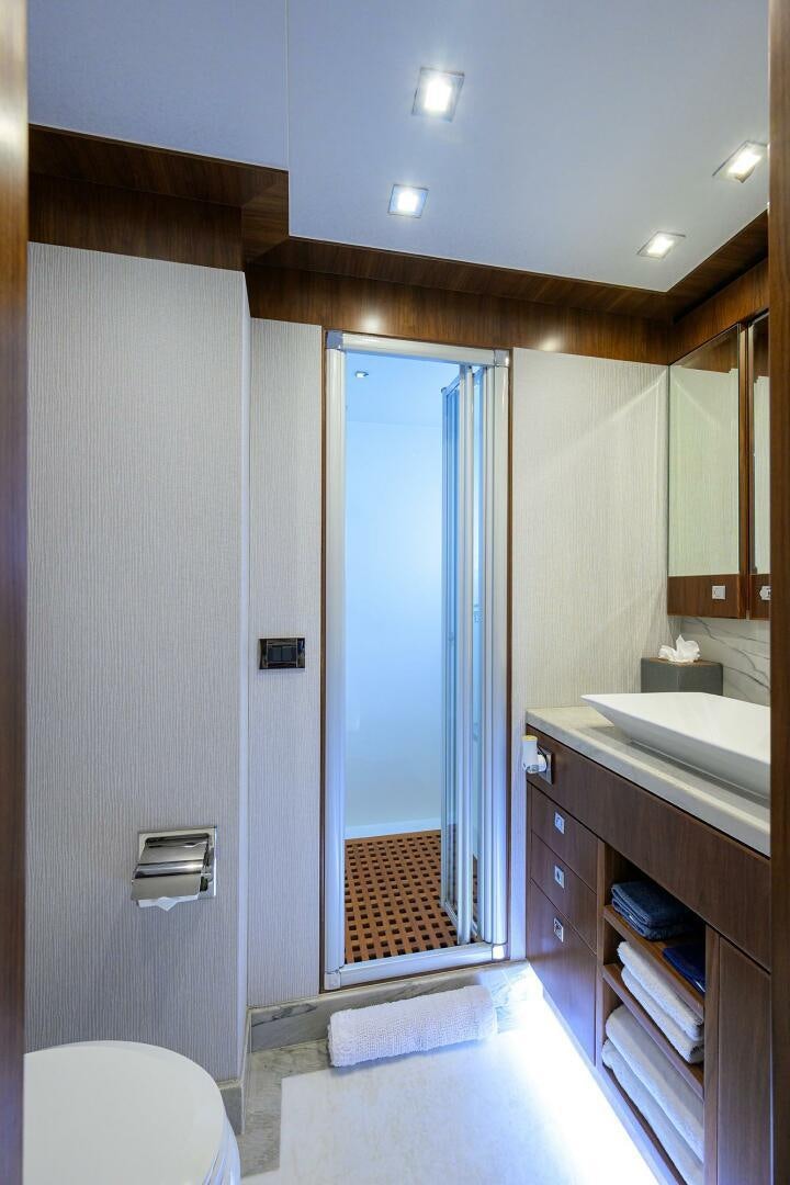 a bathroom with a sink and a mirror aboard SECOND AMENDMENT Yacht for Sale