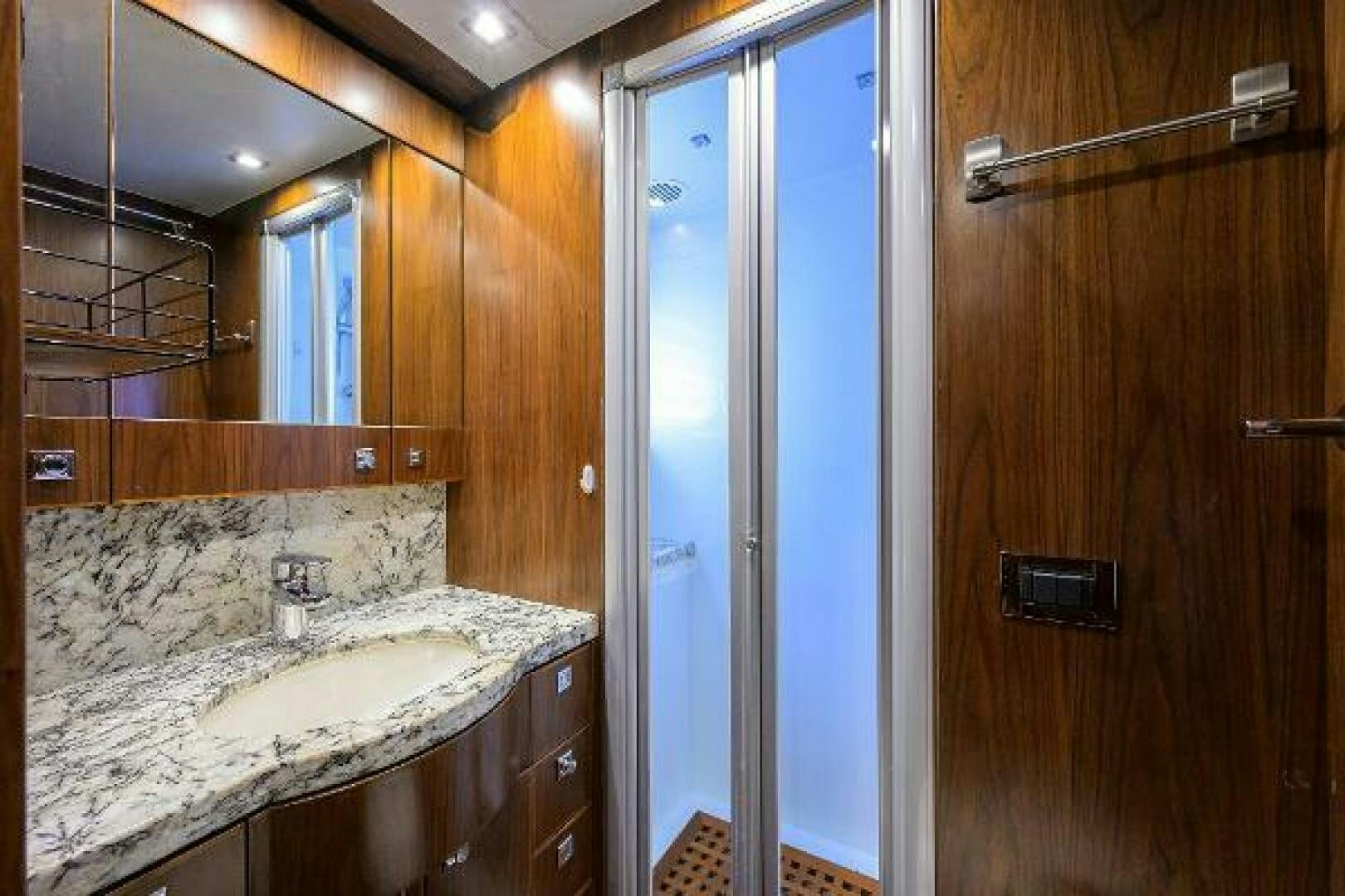 a bathroom with a sink and a mirror aboard SECOND AMENDMENT Yacht for Sale