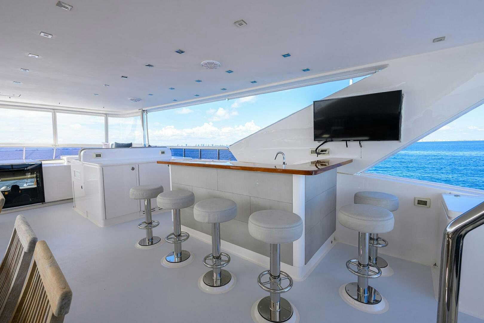 a room with stools and stools aboard SECOND AMENDMENT Yacht for Sale