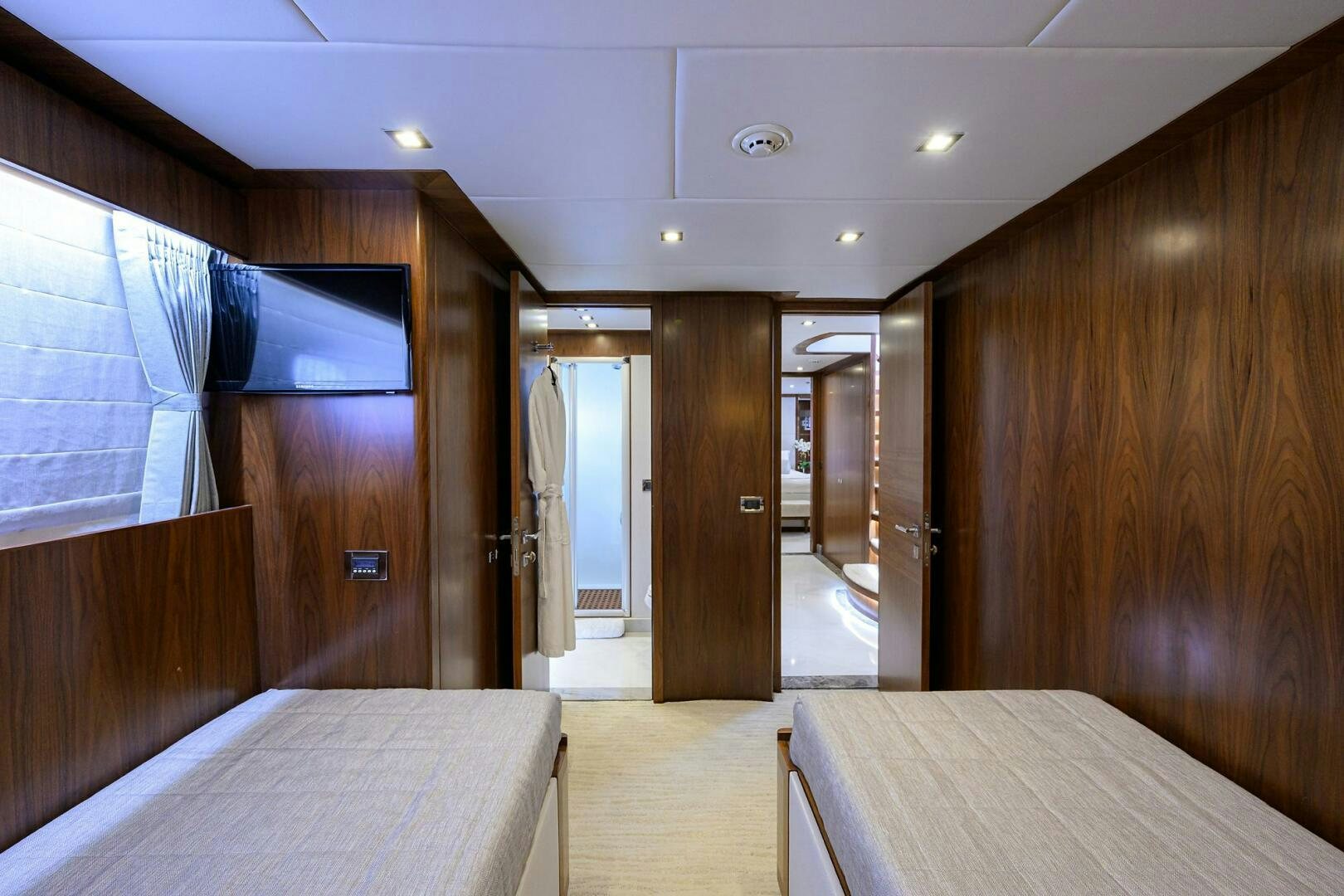 a room with a bed and a desk aboard SECOND AMENDMENT Yacht for Sale