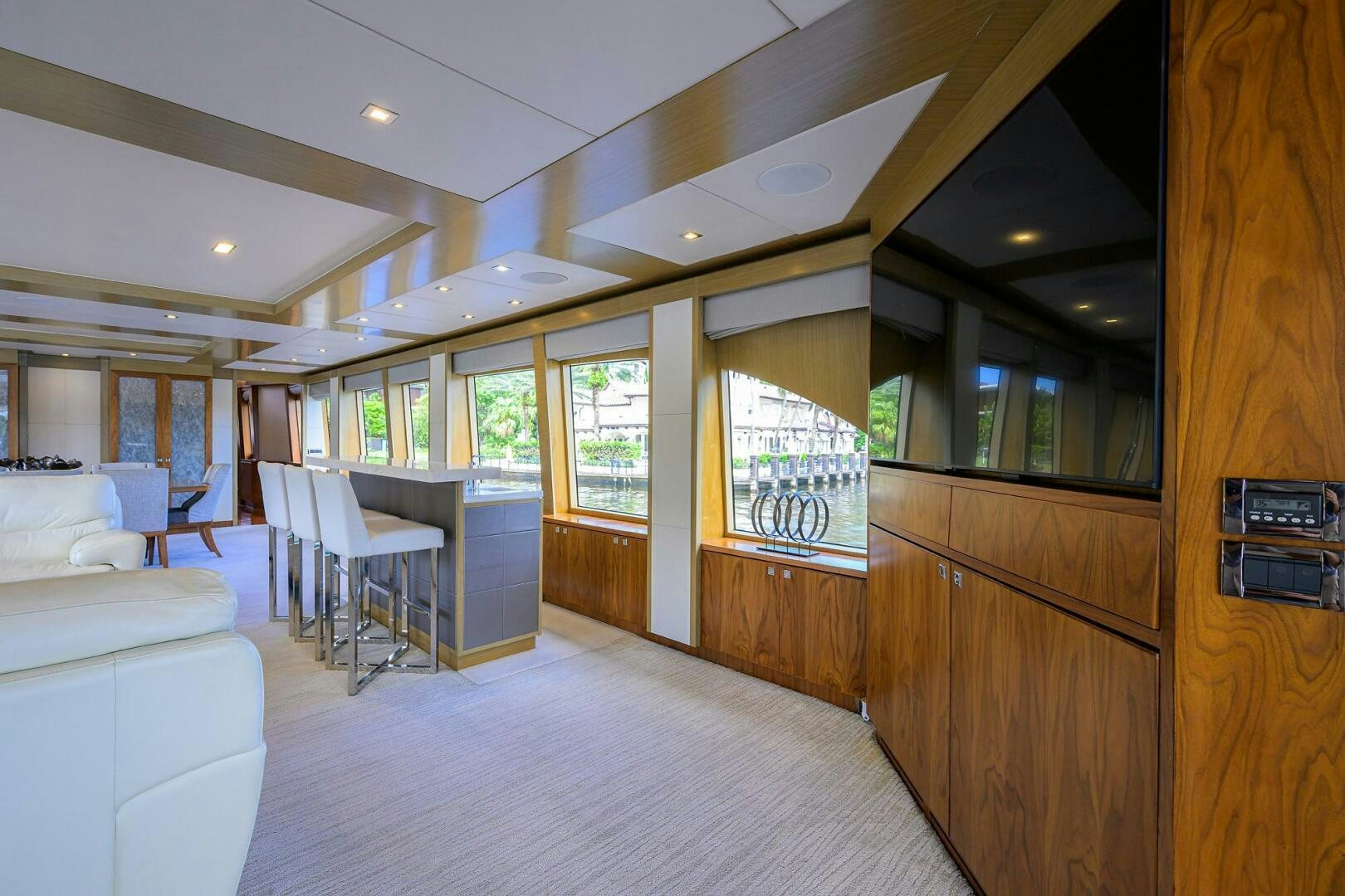 a room with a wood wall and a table and chairs aboard SECOND AMENDMENT Yacht for Sale