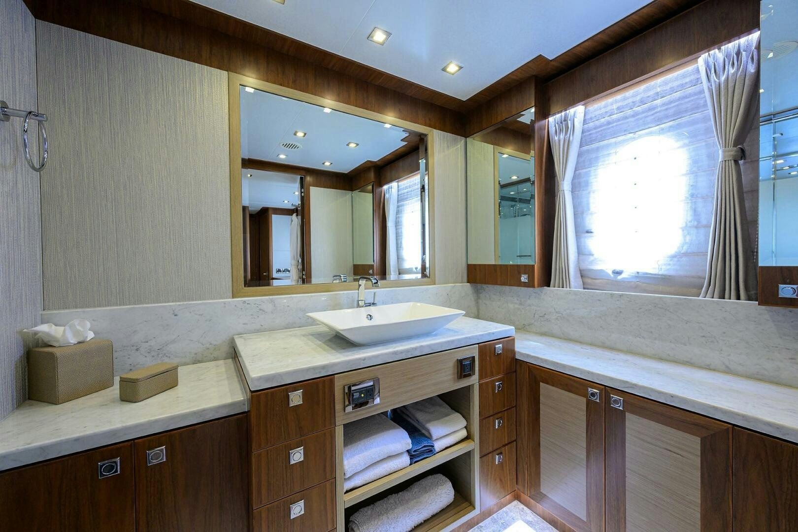 a bathroom with a sink and a mirror aboard SECOND AMENDMENT Yacht for Sale
