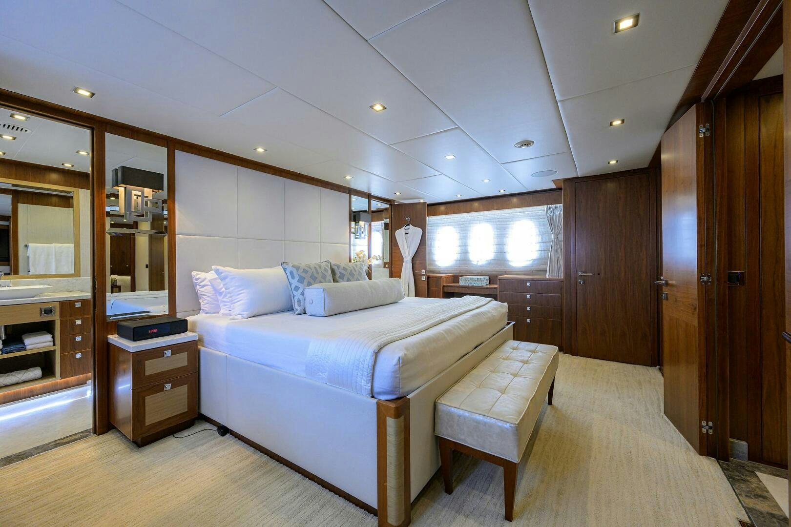 a bedroom with a bed and a desk aboard SECOND AMENDMENT Yacht for Sale