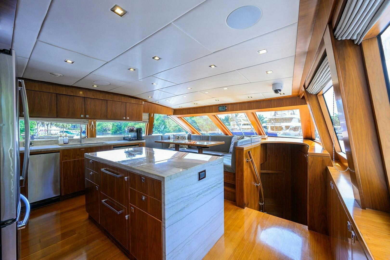 a large kitchen with wooden cabinets aboard SECOND AMENDMENT Yacht for Sale
