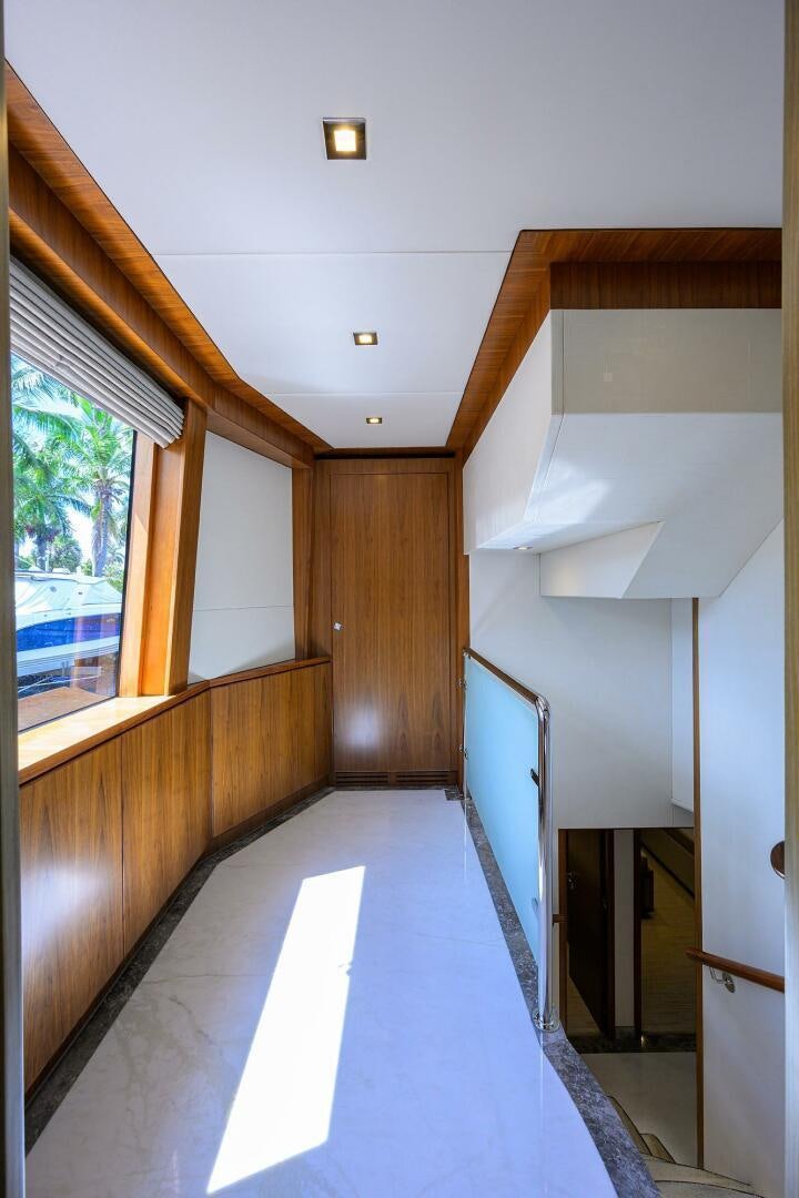 a long hallway with a window aboard SECOND AMENDMENT Yacht for Sale