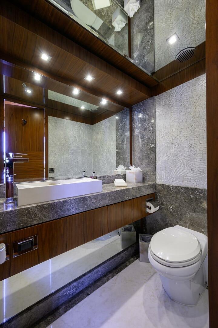 a bathroom with a large mirror aboard SECOND AMENDMENT Yacht for Sale