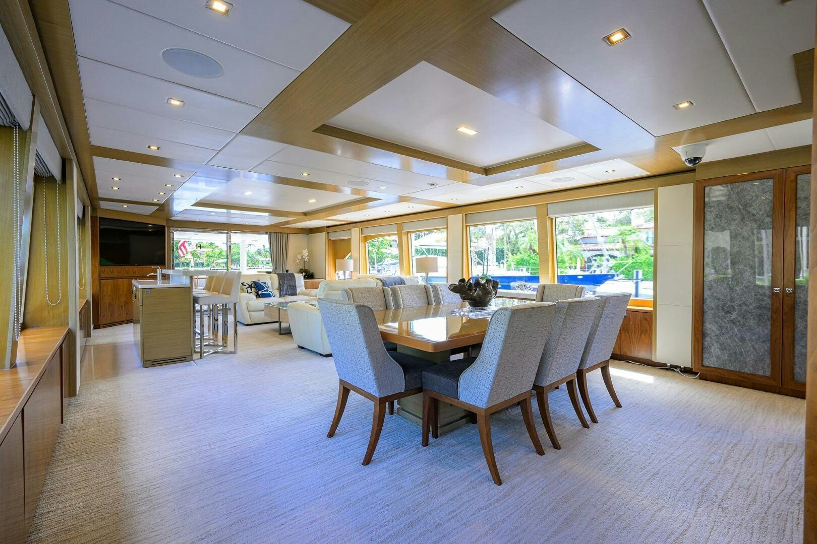 a large room with a table and chairs aboard SECOND AMENDMENT Yacht for Sale