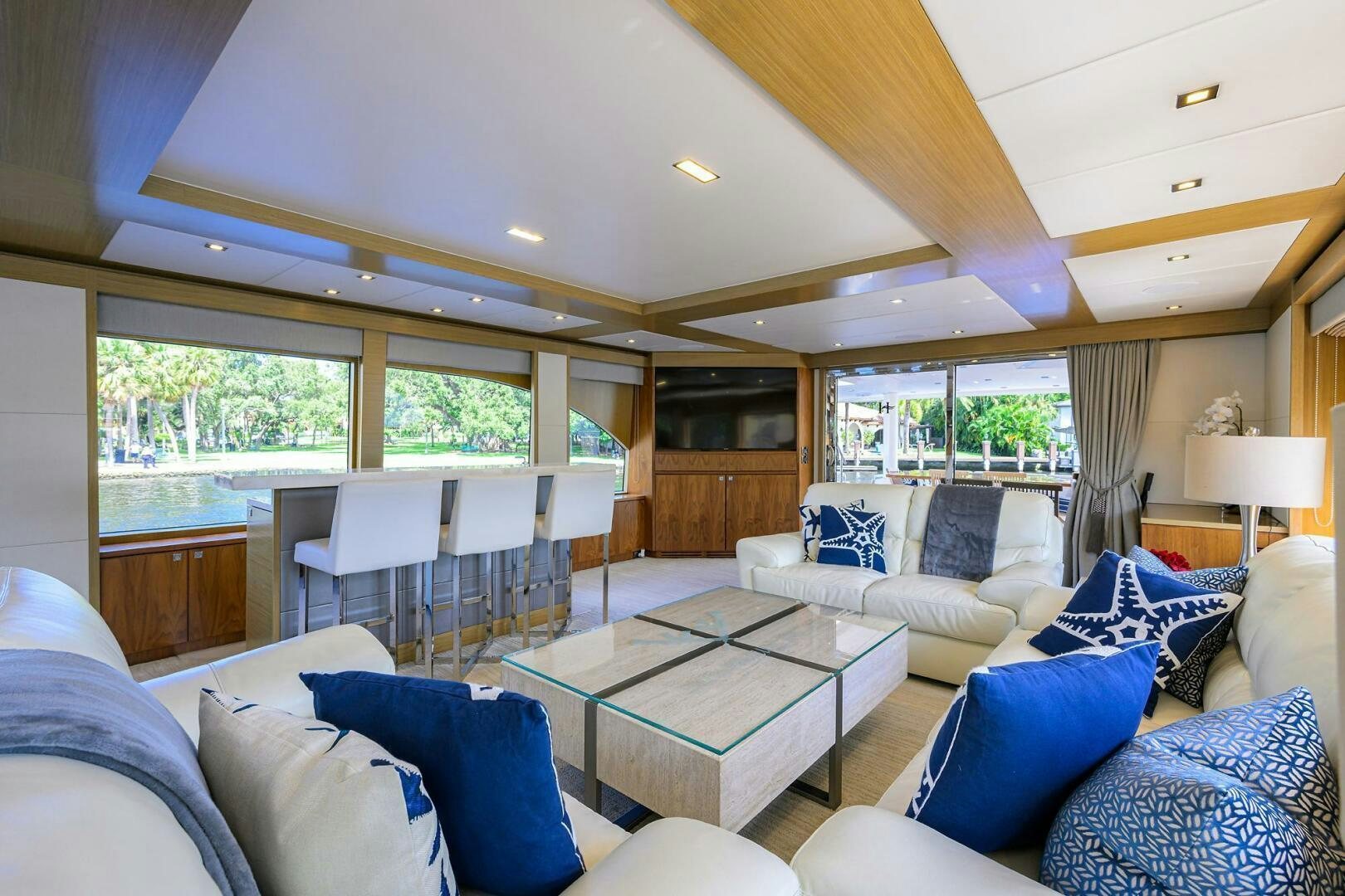 a living room with a large window aboard SECOND AMENDMENT Yacht for Sale