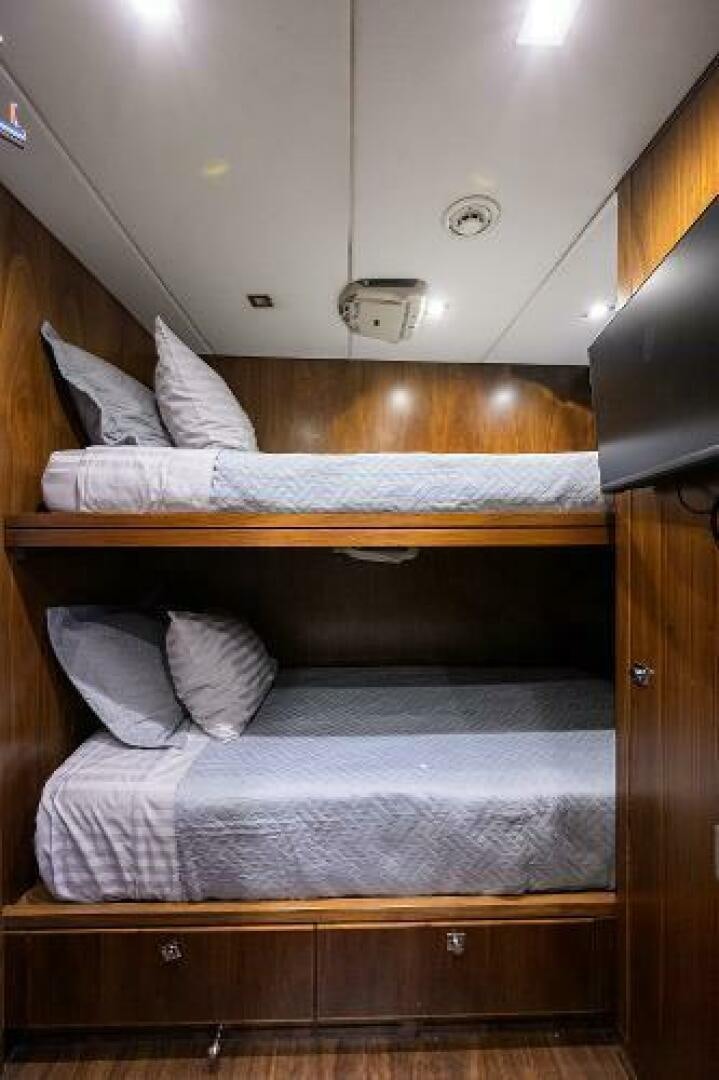 a bed with a white pillow aboard SECOND AMENDMENT Yacht for Sale