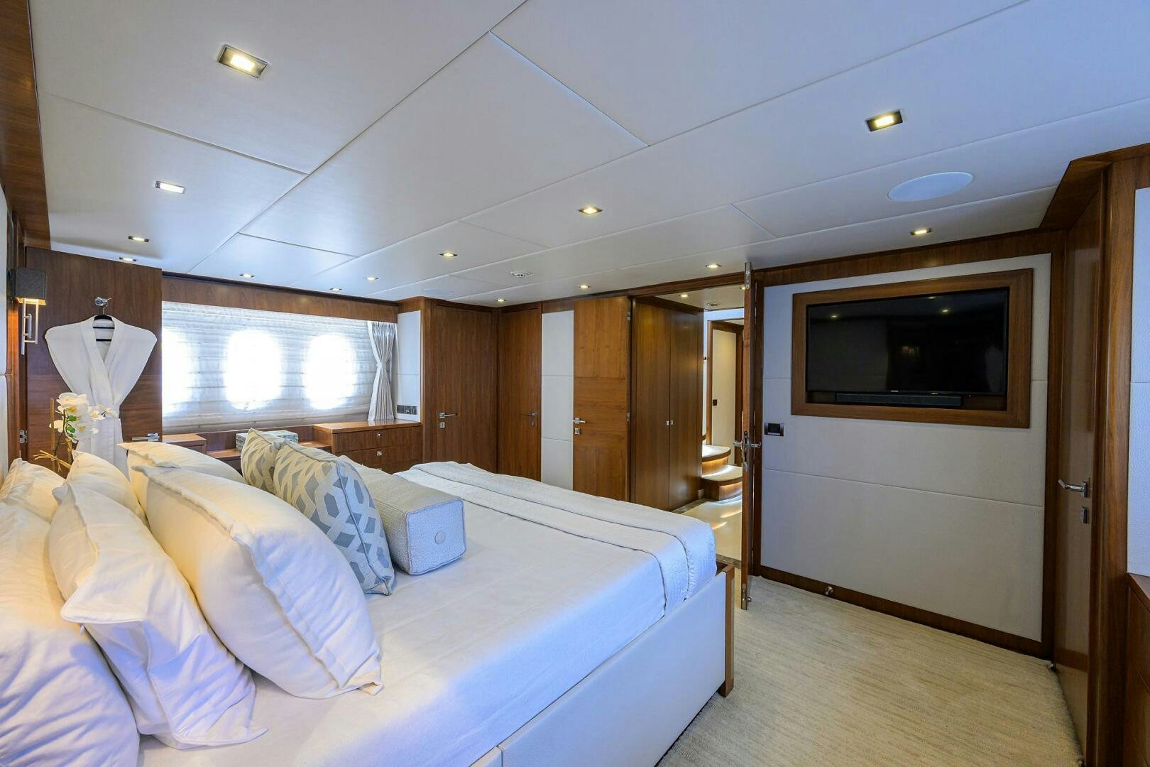 a room with a bed and a television aboard SECOND AMENDMENT Yacht for Sale