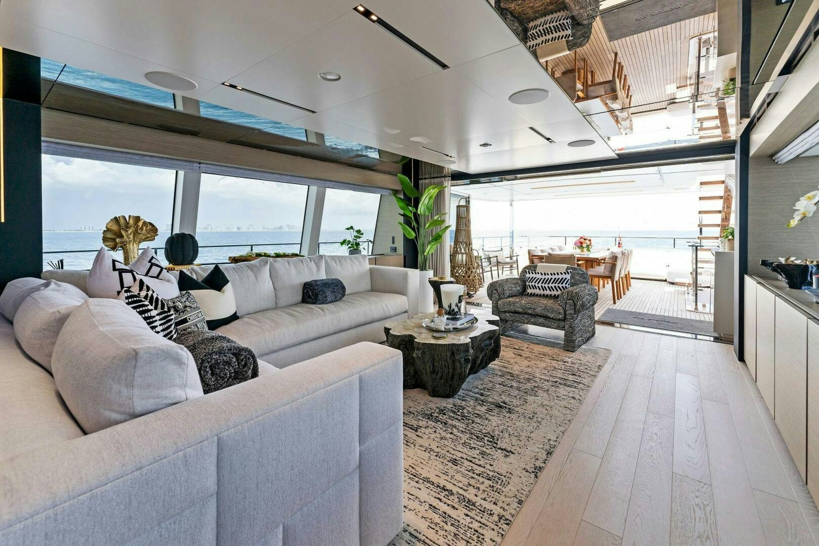 a living room with a large window aboard FAMILIA Yacht for Sale